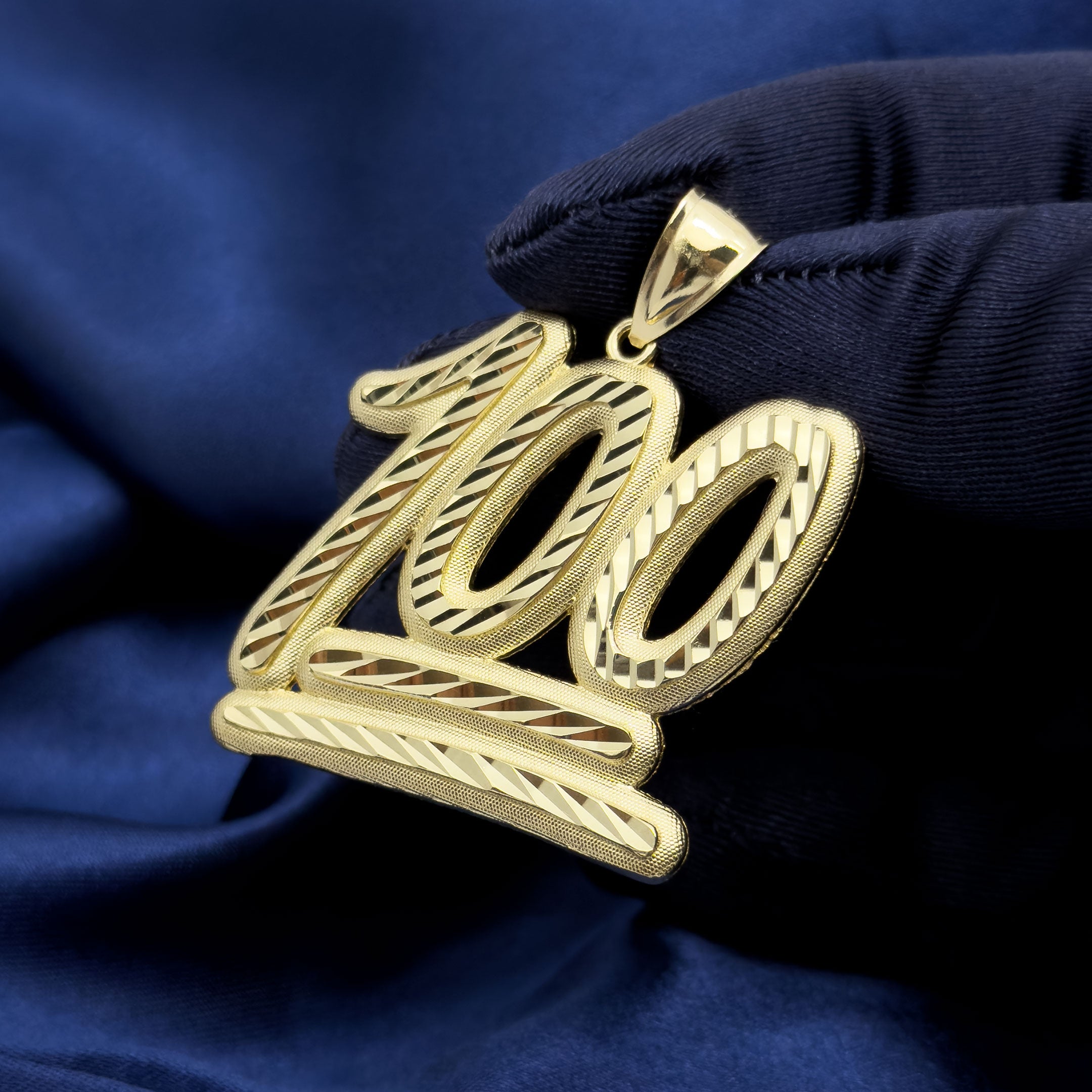 10k Yellow Gold 100 Emoji Symbol Pendant with Diamond Cuts on blue background