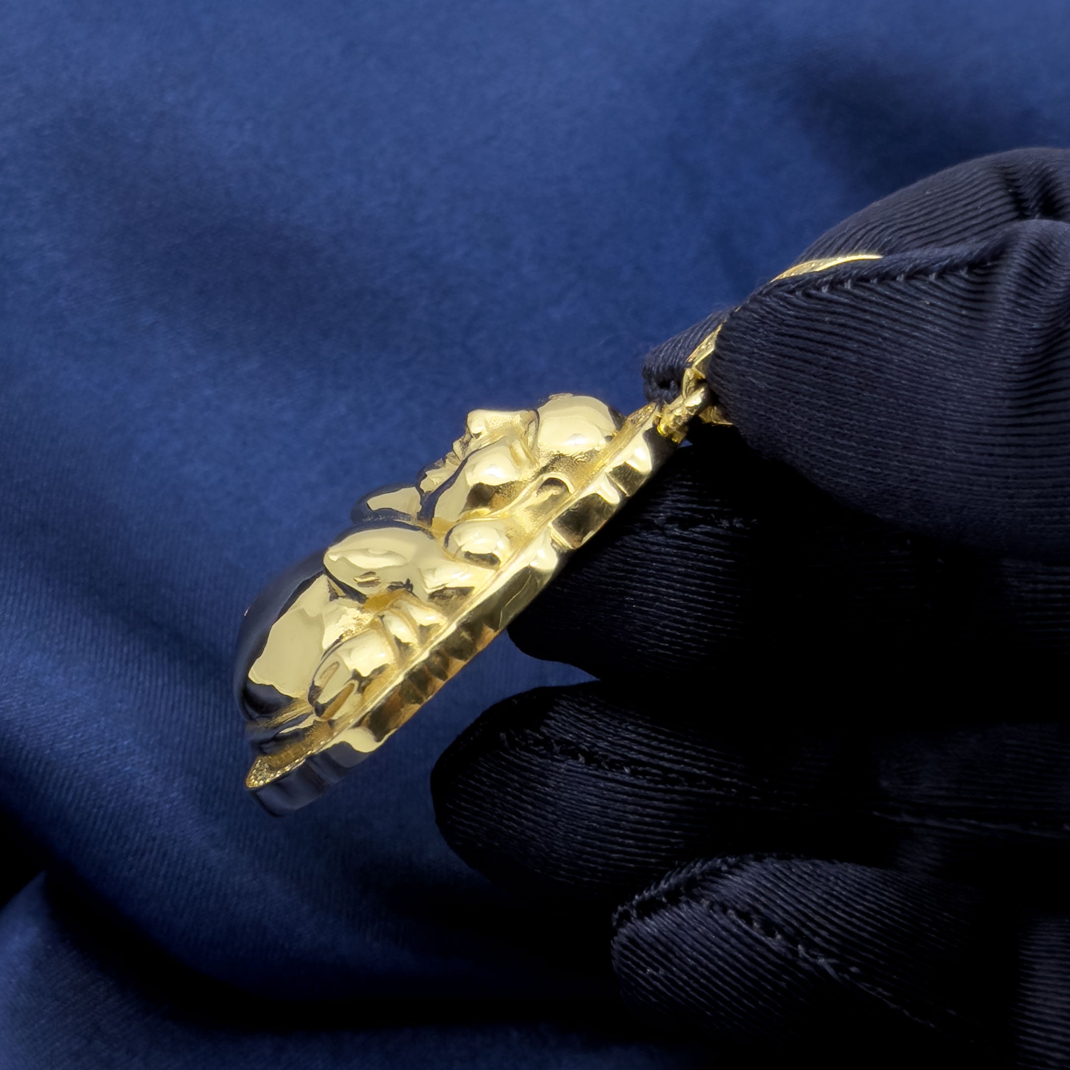 14k Yellow Gold Happy Buddha Pendant with CZ Stones on blue background side