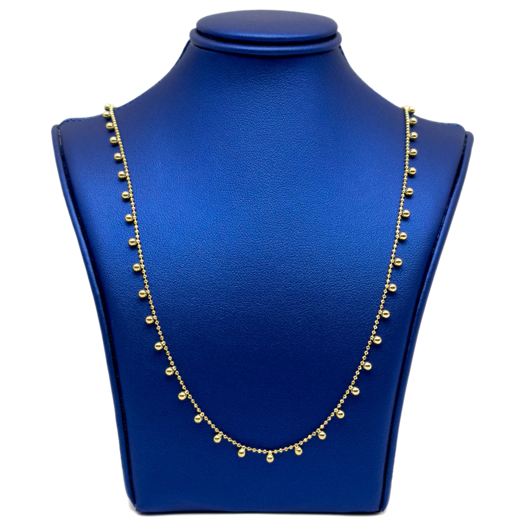 10k yellow gold necklace with moon bead link chain and ball design hanging on a black neck display