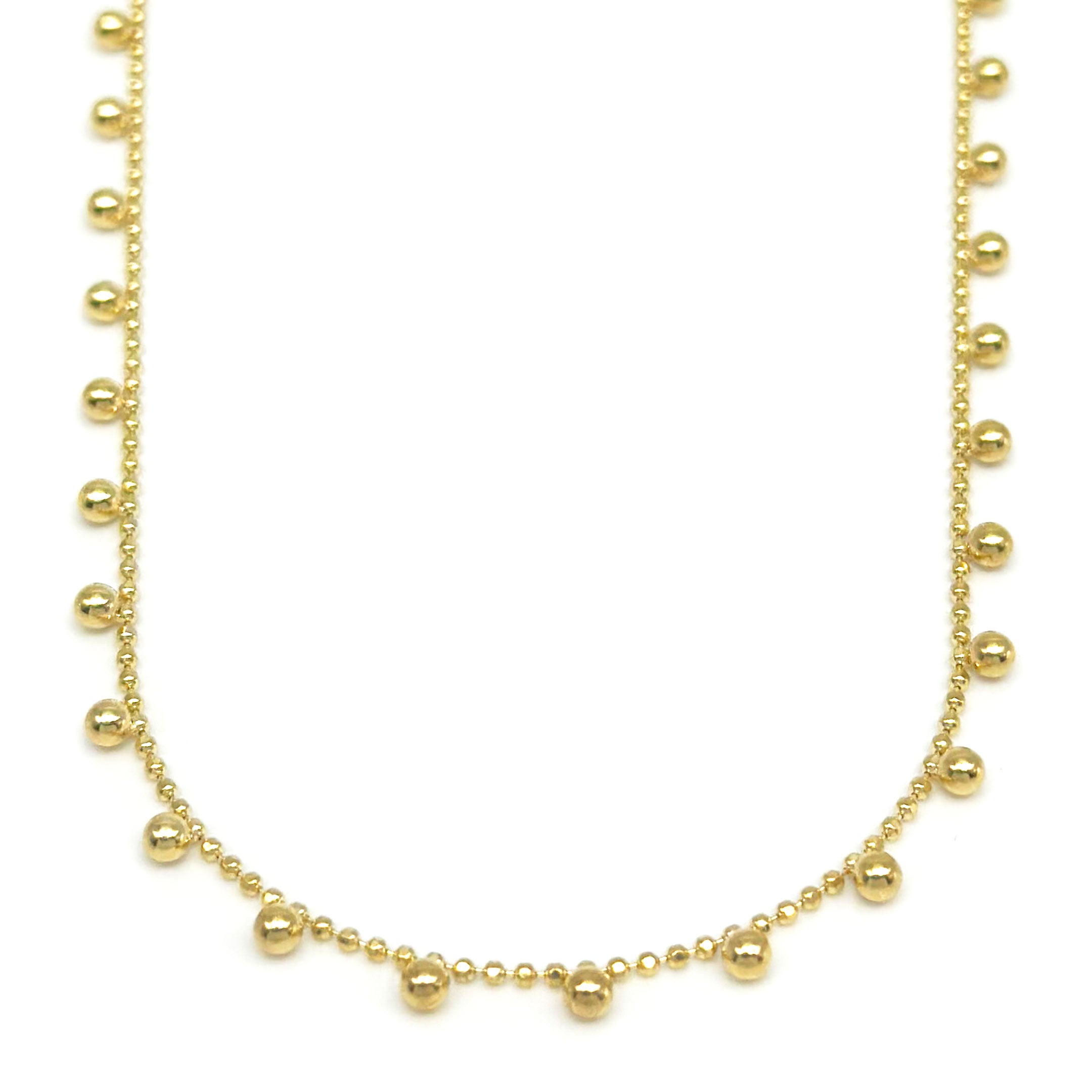 10k yellow gold necklace with moon bead link chain and ball design hanging on a white background