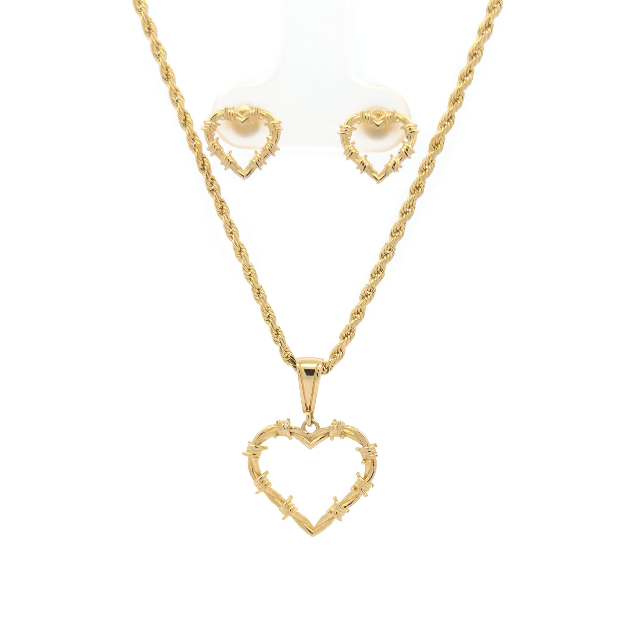 Gold heart-shaped necklace and earrings on a white background