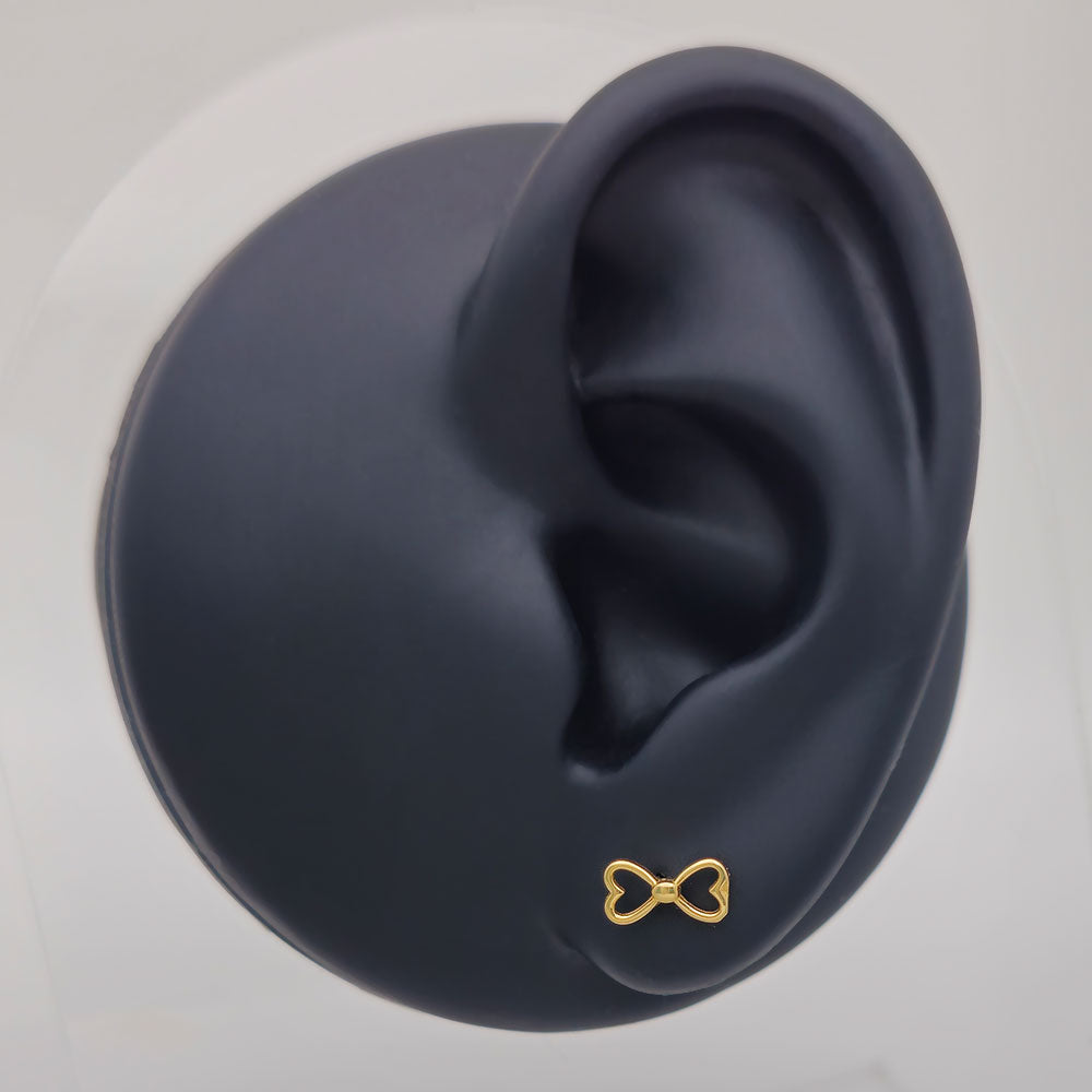 14k Bow Tie Outline Stud Earrings on Ear Display