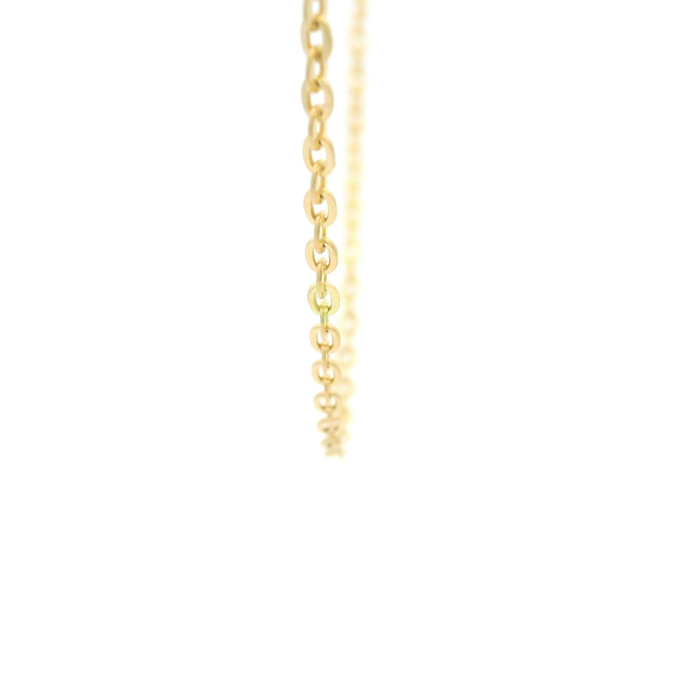10k yellow gold Flat Cable Fine Chain 1.5mm on white background close up