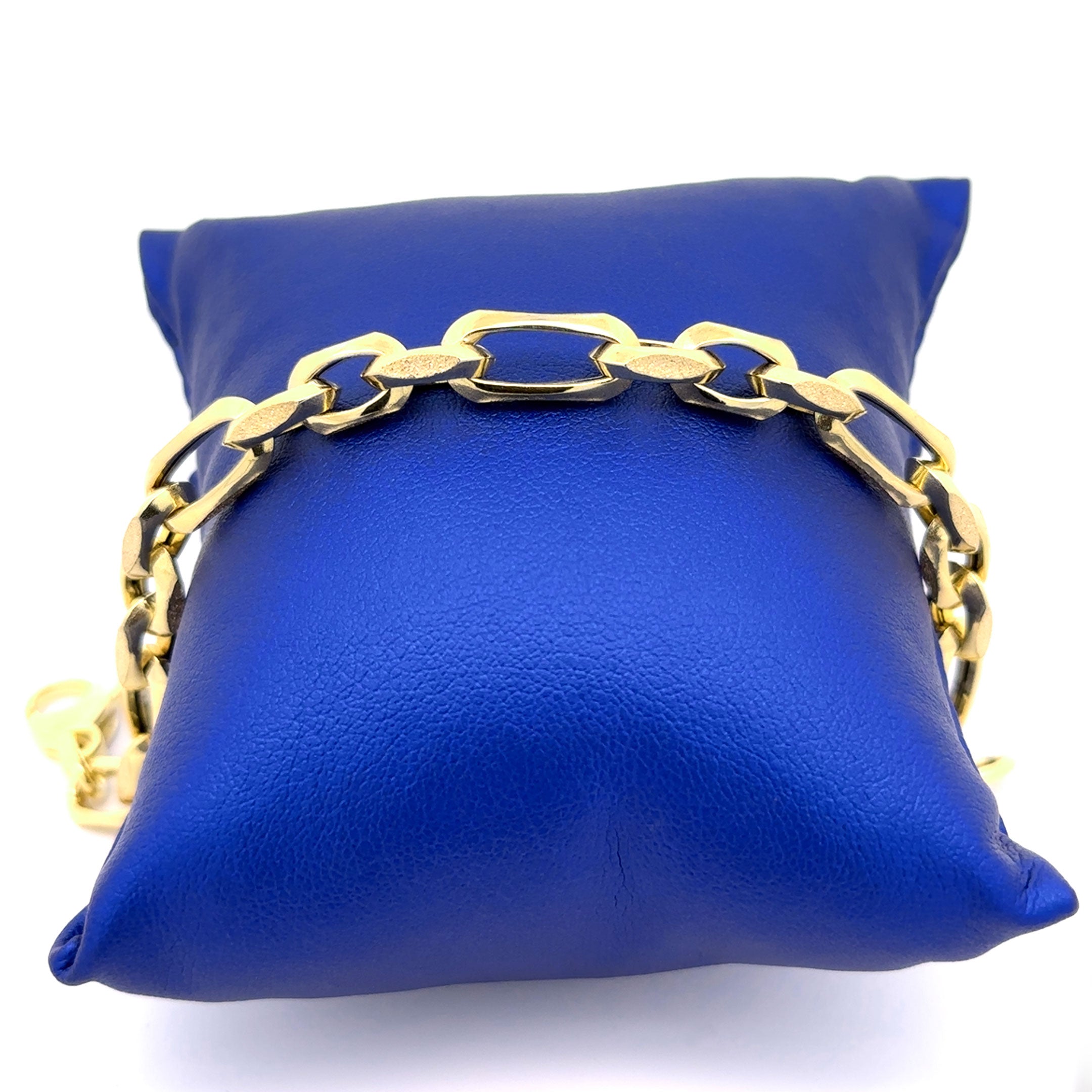 10k Fancy Cable Link Bracelet with Sandblast Design 7mm on Blue Bracelet Pillow Display