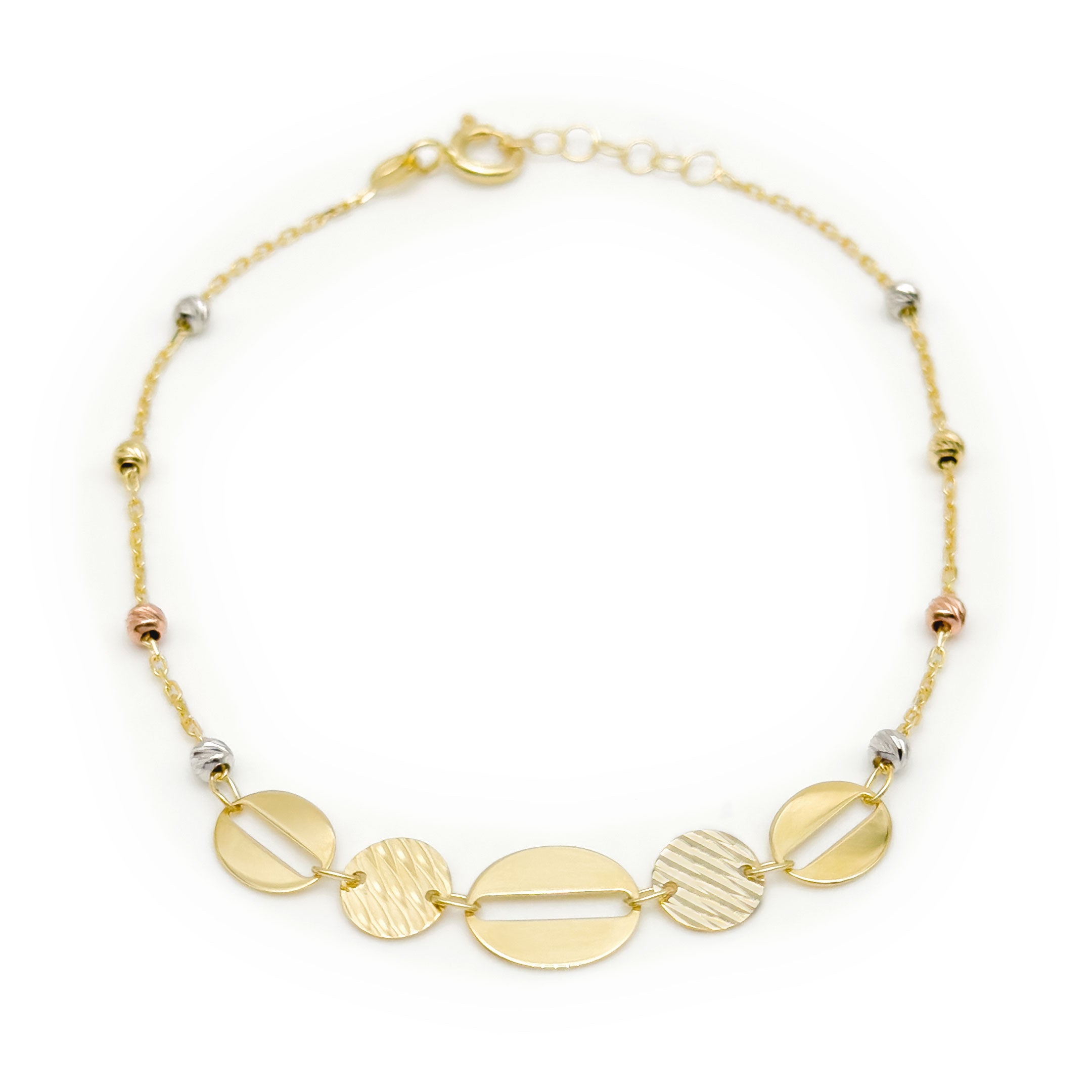 A delicate gold chain bracelet with five oval and disc charms in varying textures and sizes, accented by small white and rose gold beads, on a white background.