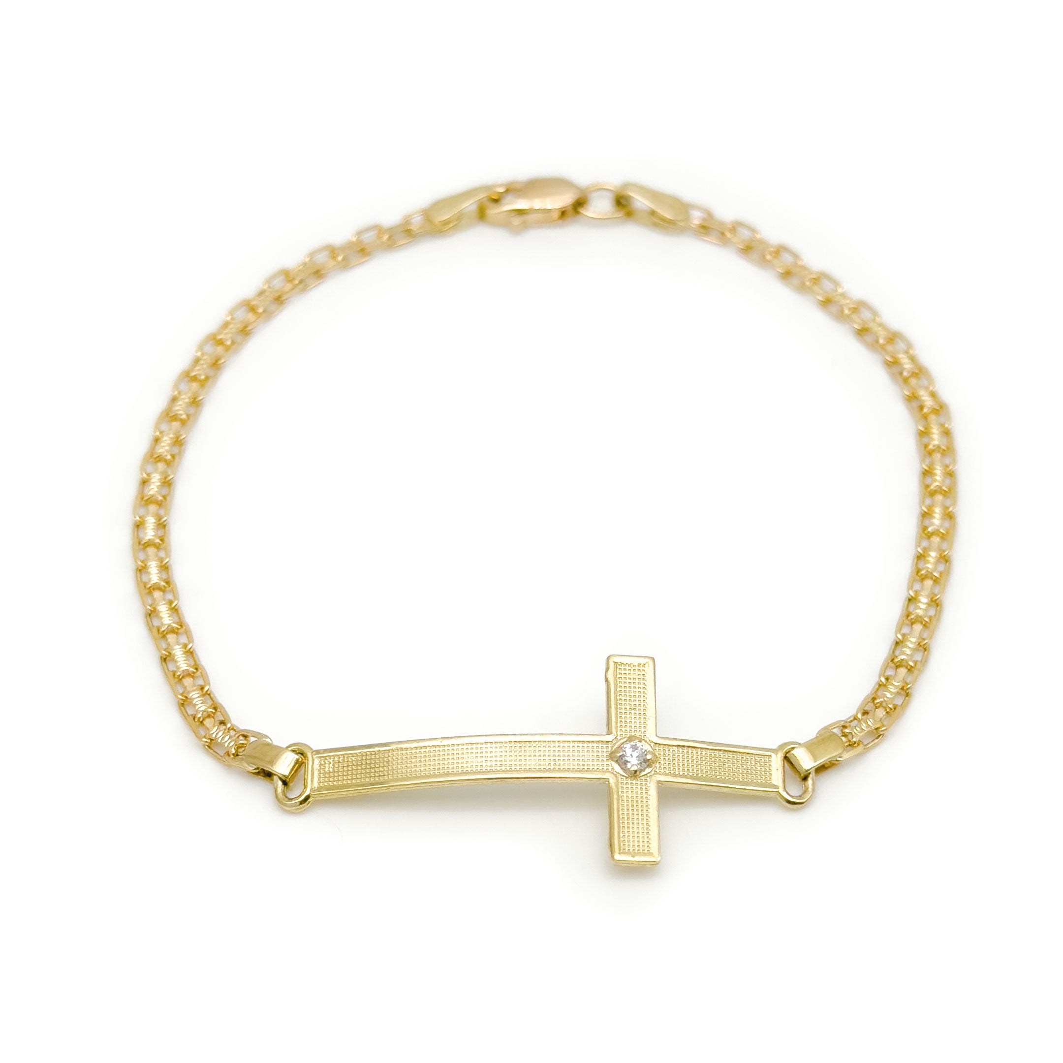 A gold chain bracelet with a horizontal cross pendant featuring a small cz stone at the center, photographed on a plain white background.