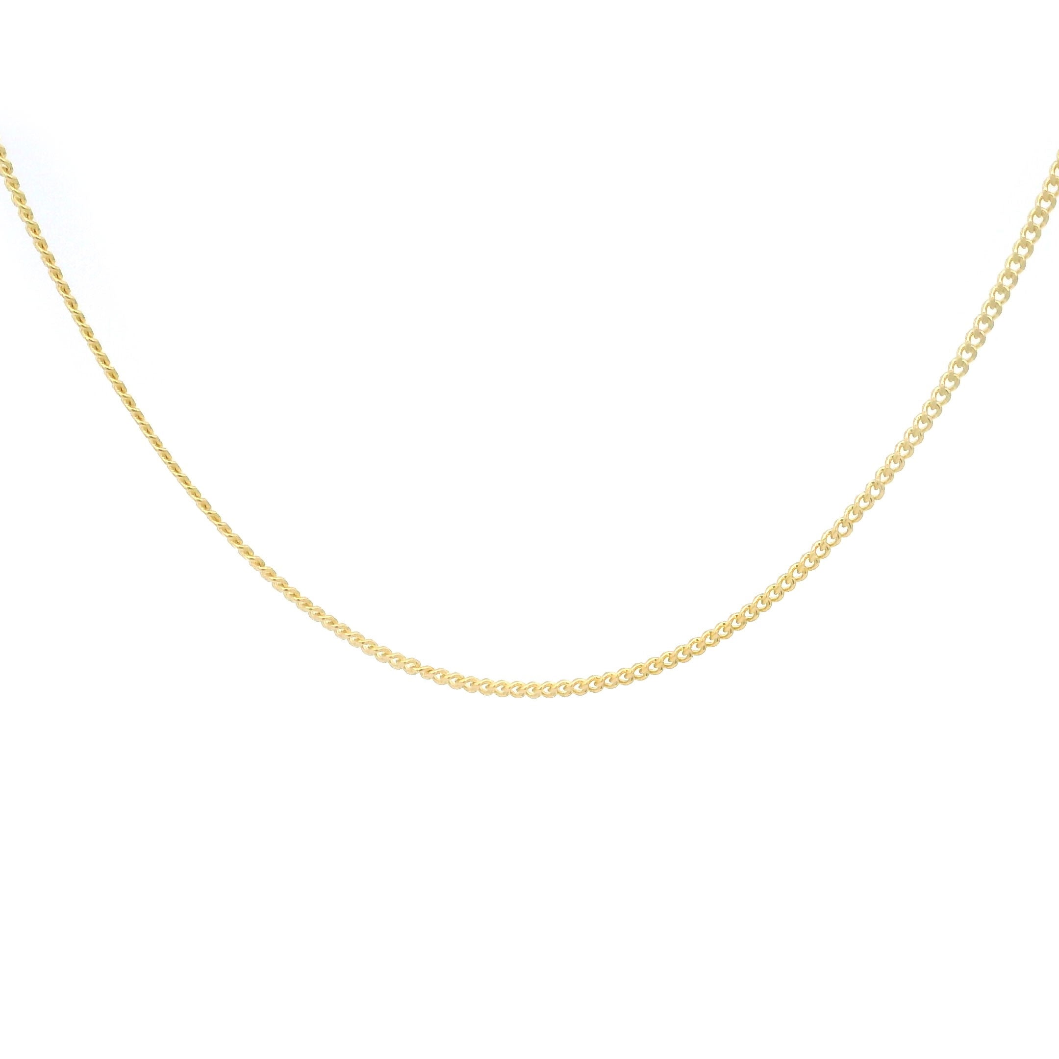 10k gold thin Cuban Chain on white background