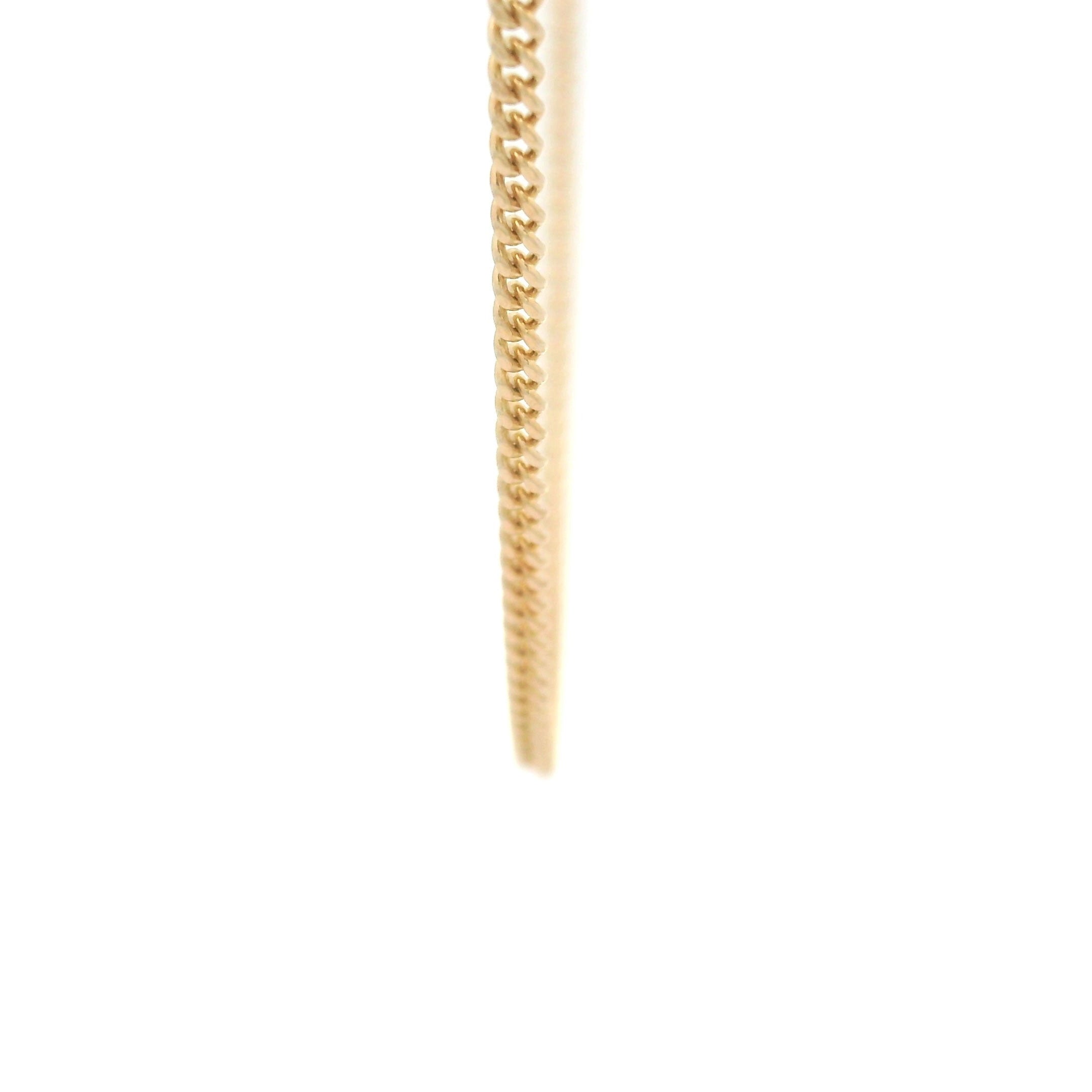 14k solid gold cuban chain necklace 1.5mm on a white background close up