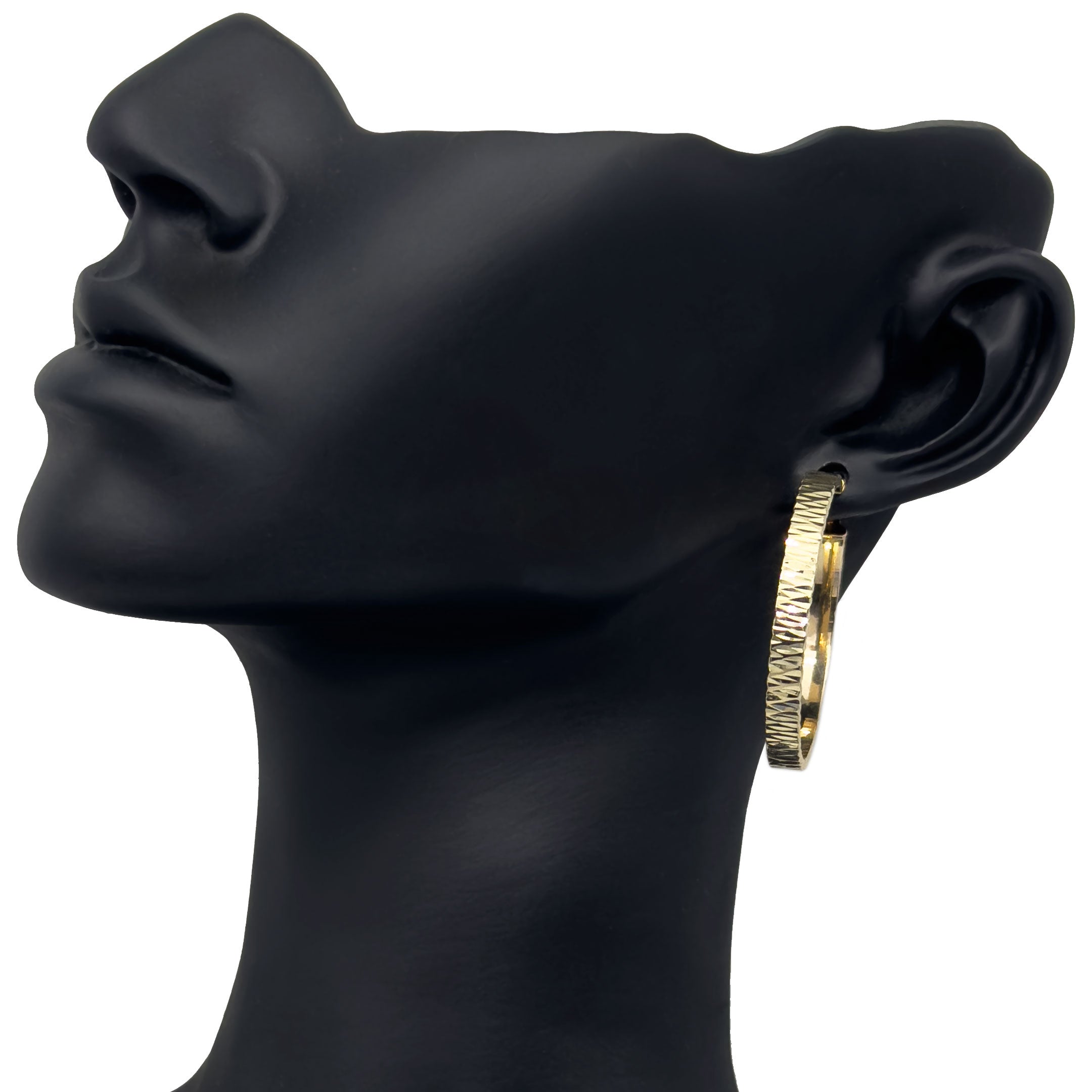 Gold diamond cut hoop earring on a black mannequin ear