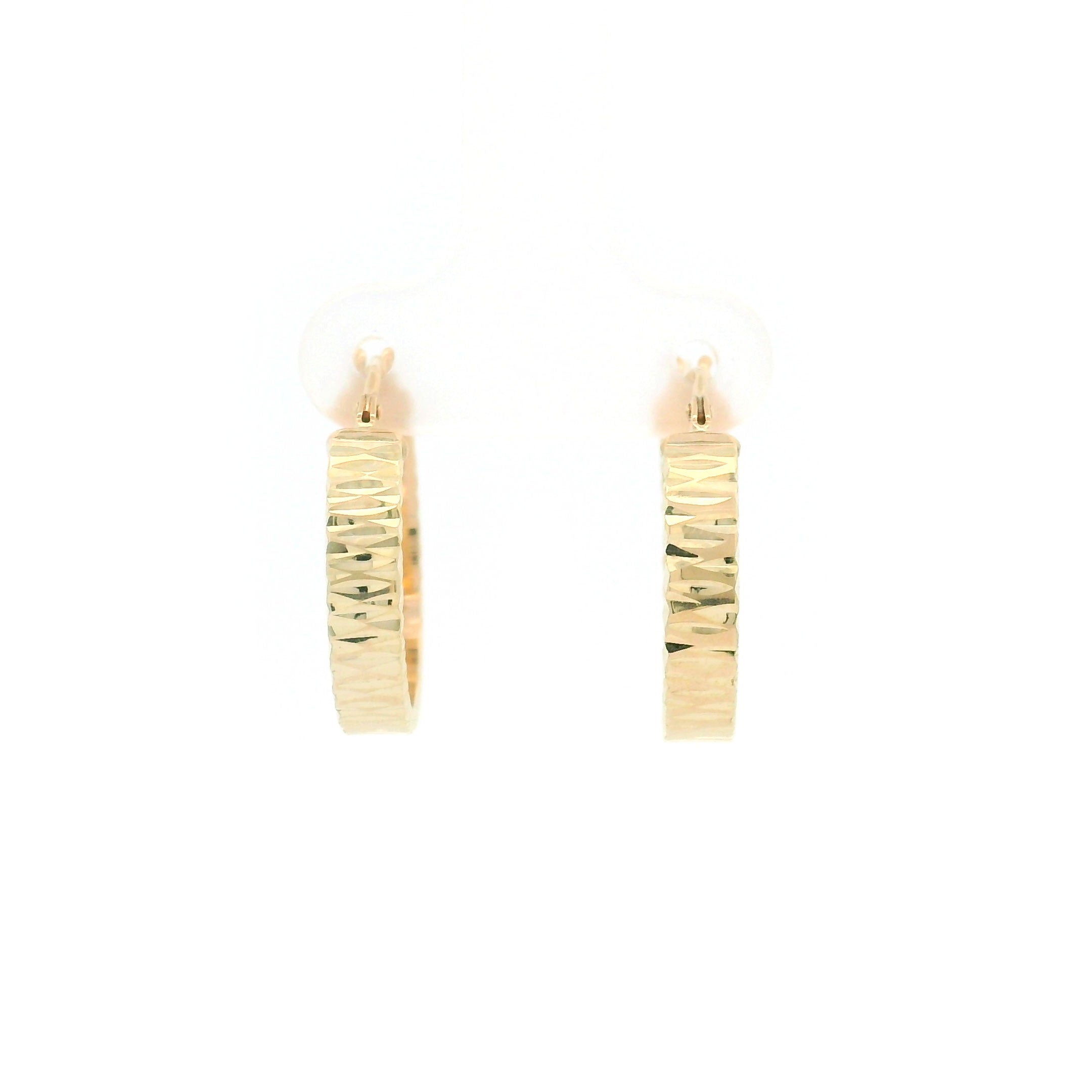 Gold diamond cut hoop earrings on a white background front view
