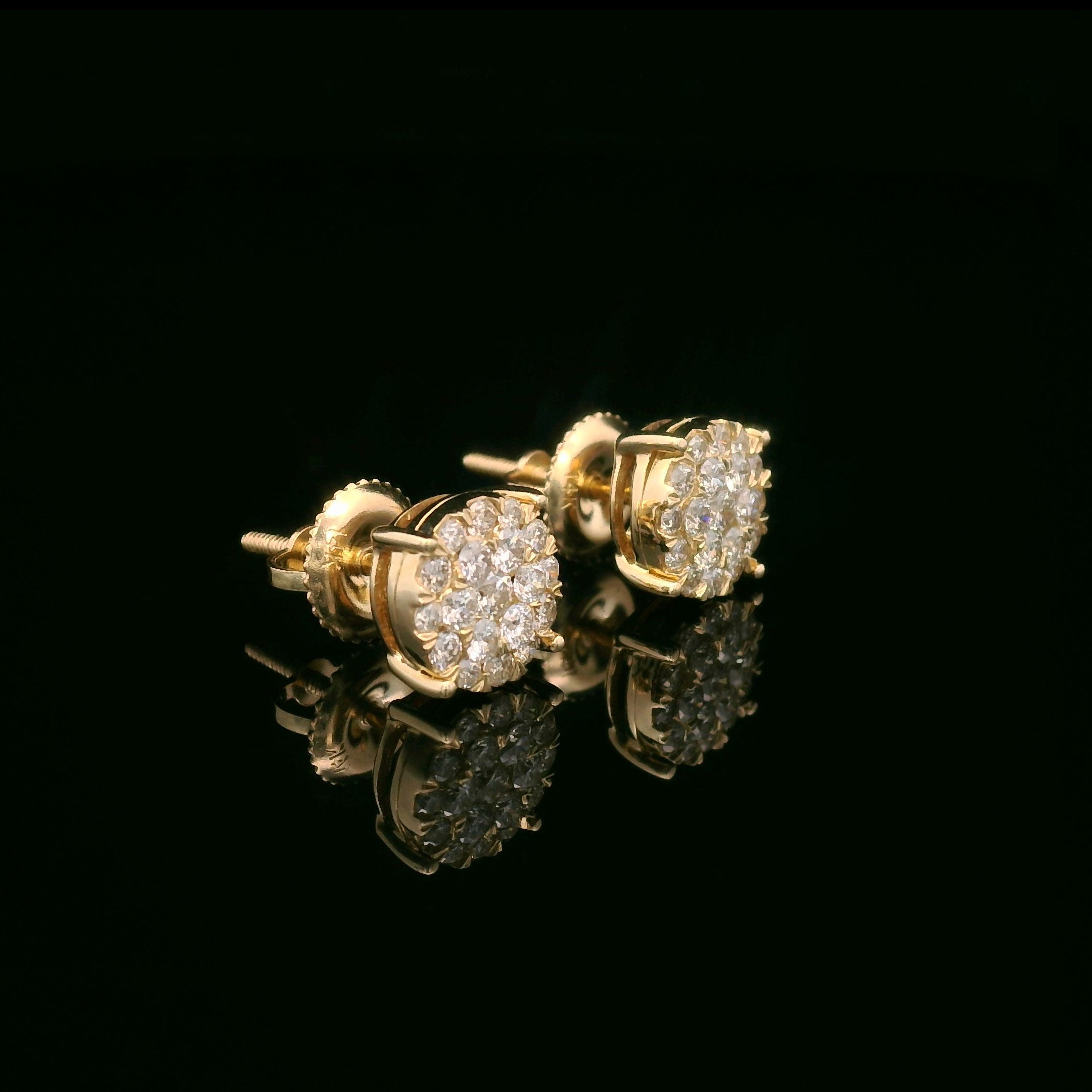 Round diamond earrings set in 14k yellow gold side