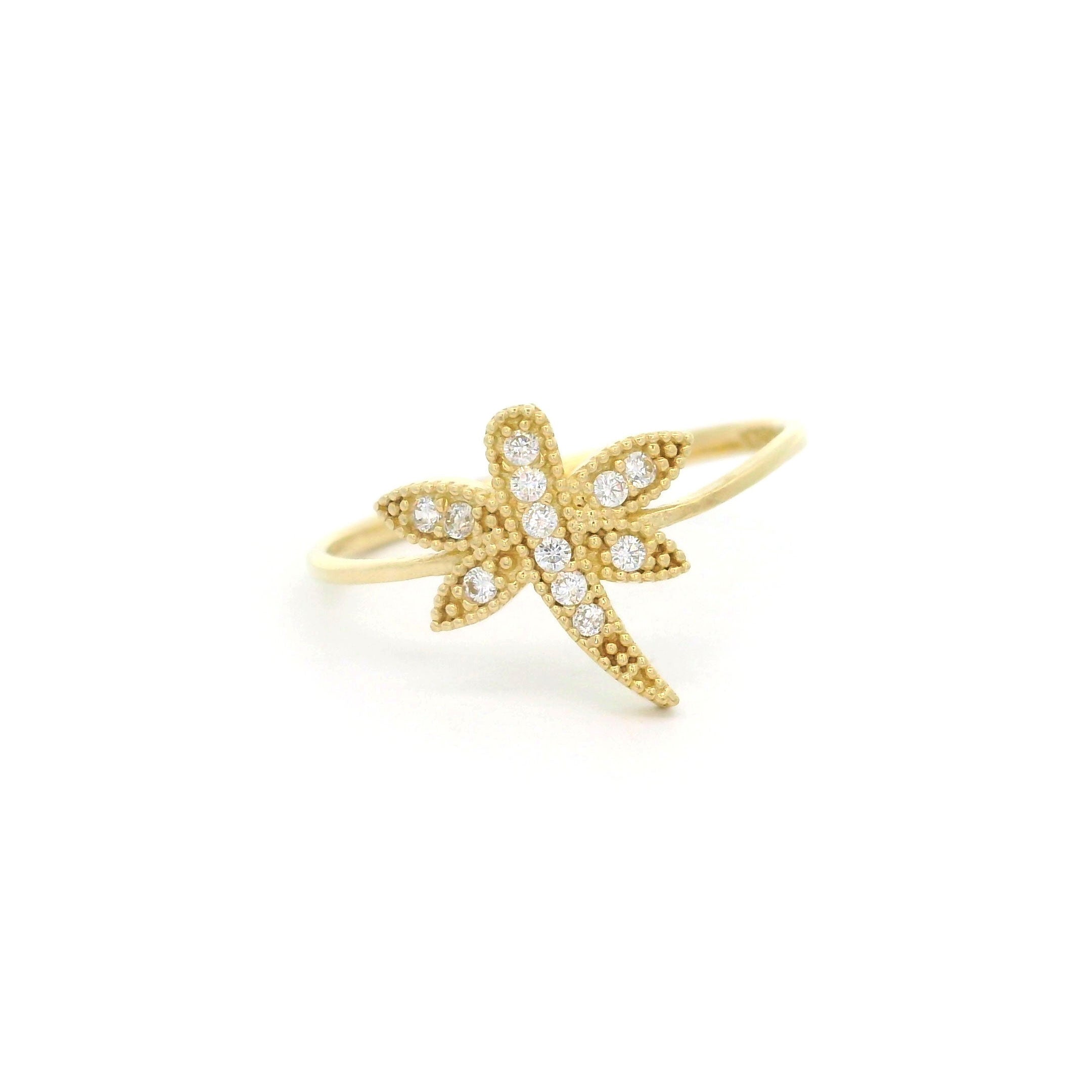 10k yellow gold ring with dragon fly and cz accents on a white background