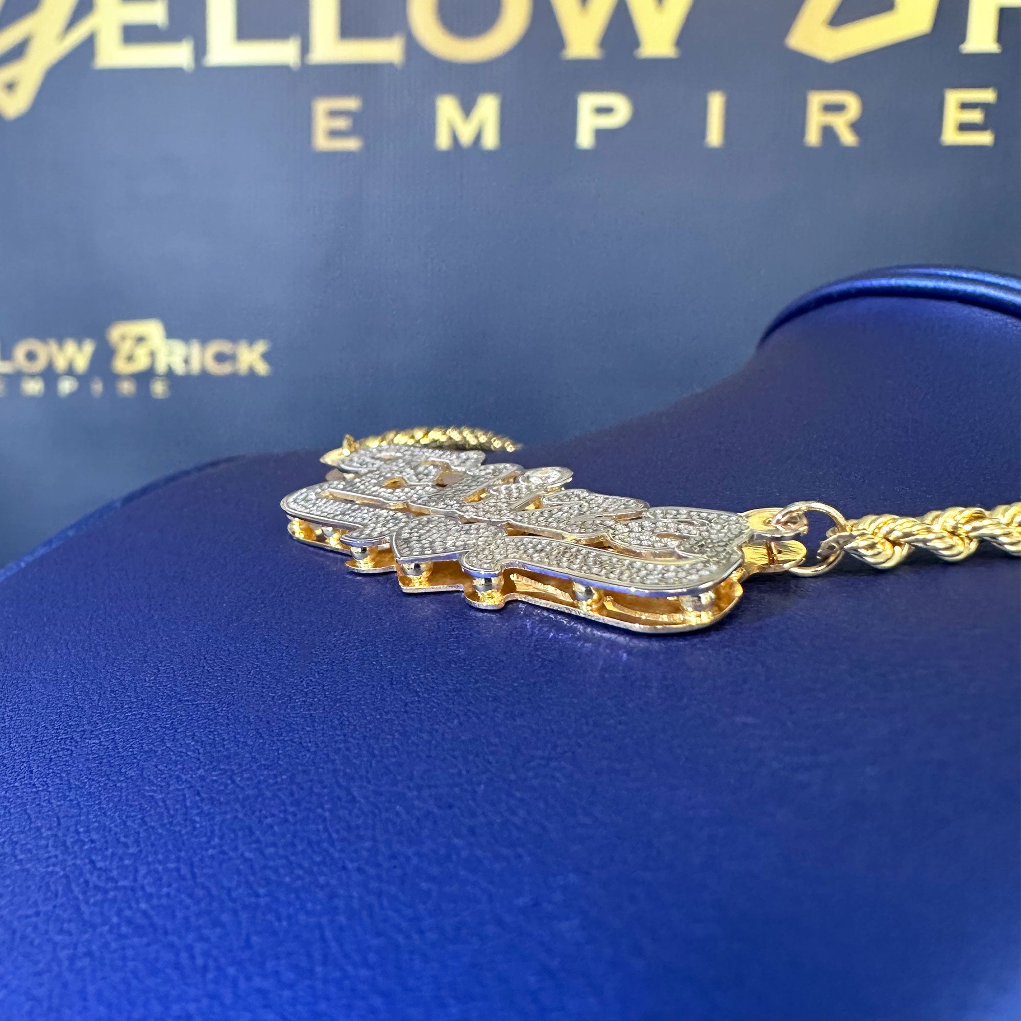 Custom Eliza name pendant with diamond cut and diamond in the "i" displayed on a rope chain angle