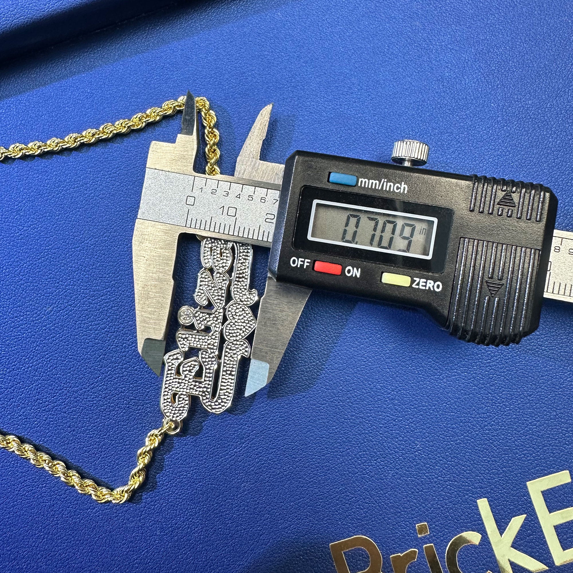 Custom Eliza name pendant with diamond cut and diamond in the "i" displayed on a rope chain height measurement