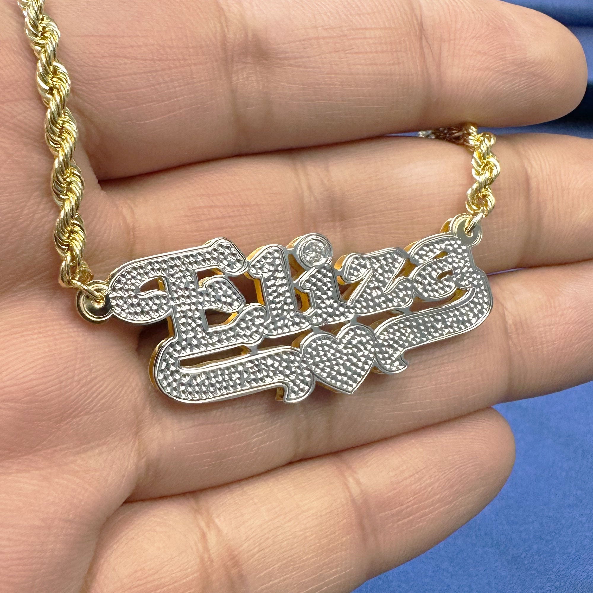 Custom Eliza name pendant with diamond cut and diamond in the 