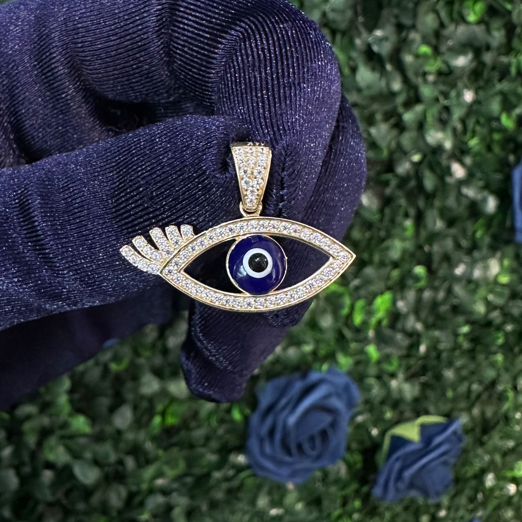 14k Dark Blue Evil Eye with Eyelash Pendant in hand
