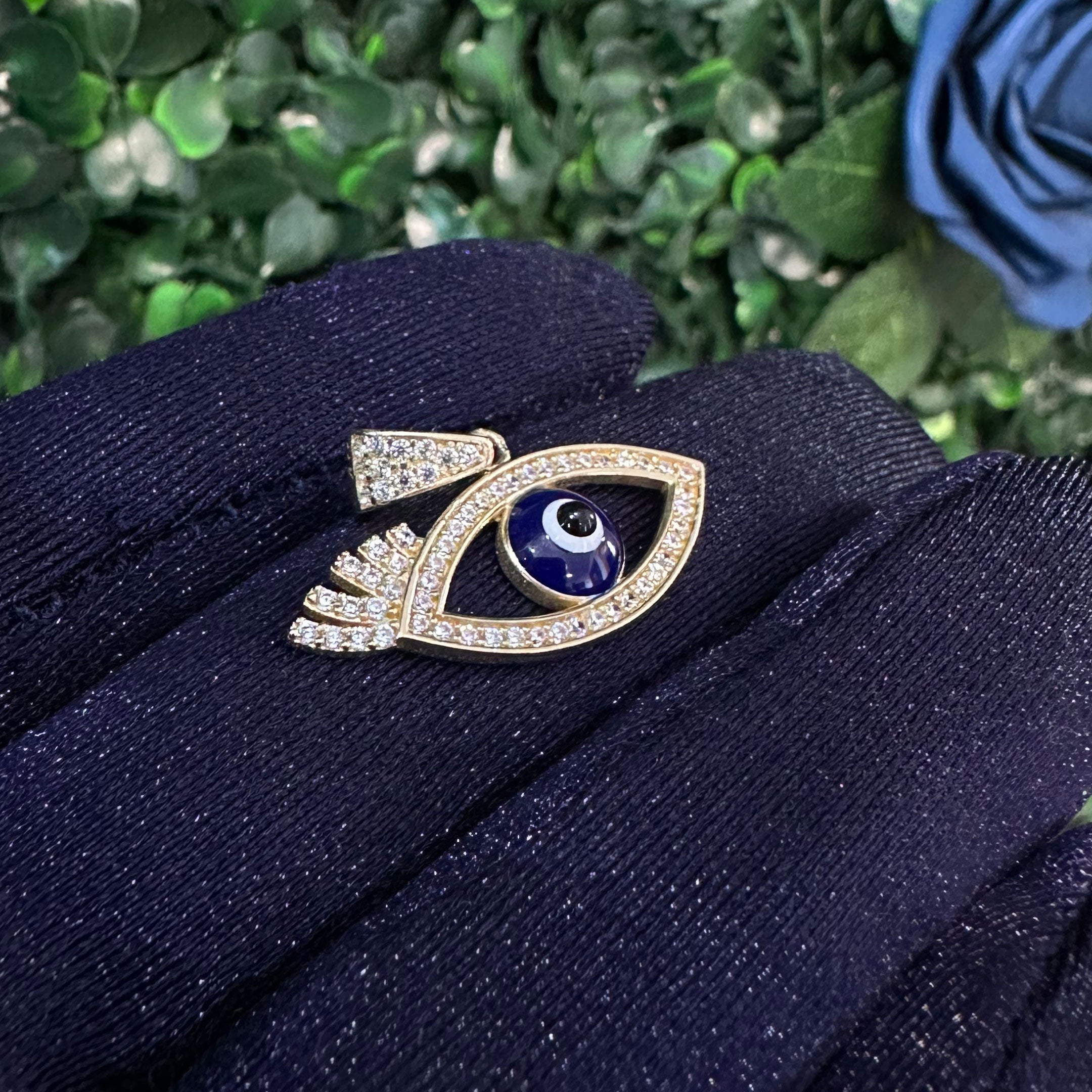 14k Dark Blue Evil Eye with Eyelash Pendant in hand angle