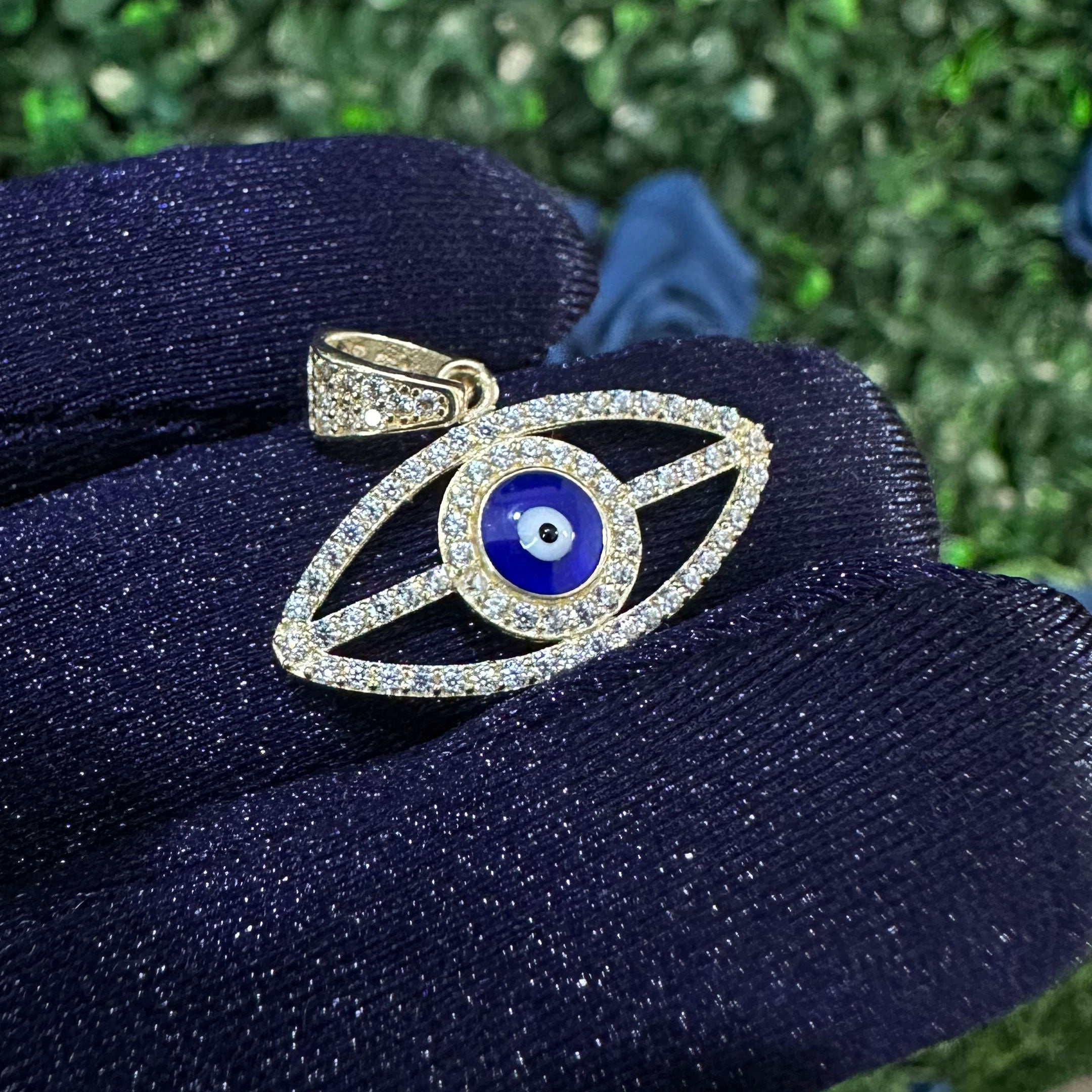 14k Blue Enamel Evil Eye Pendant close in hand