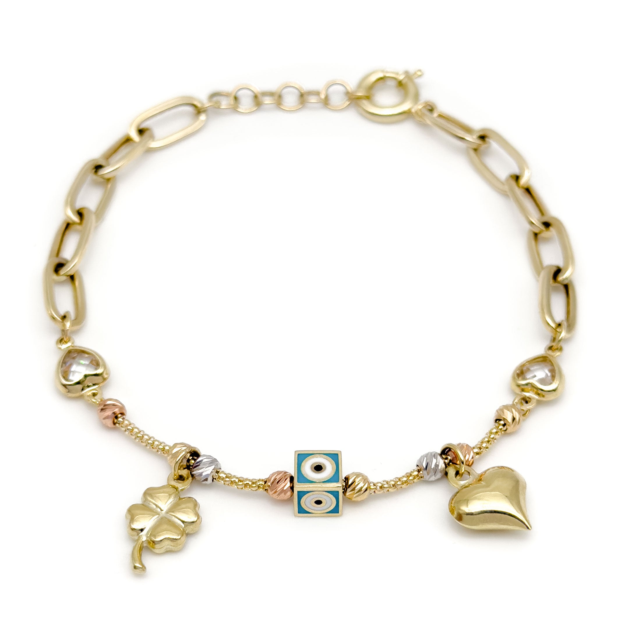 A gold cable chain bracelet with a clasp, featuring heart-shaped bezel-set clear stones, a central evil eye square charm, a dangling gold four-leaf clover charm, and a dangling gold heart charm, all displayed on a clean white background.