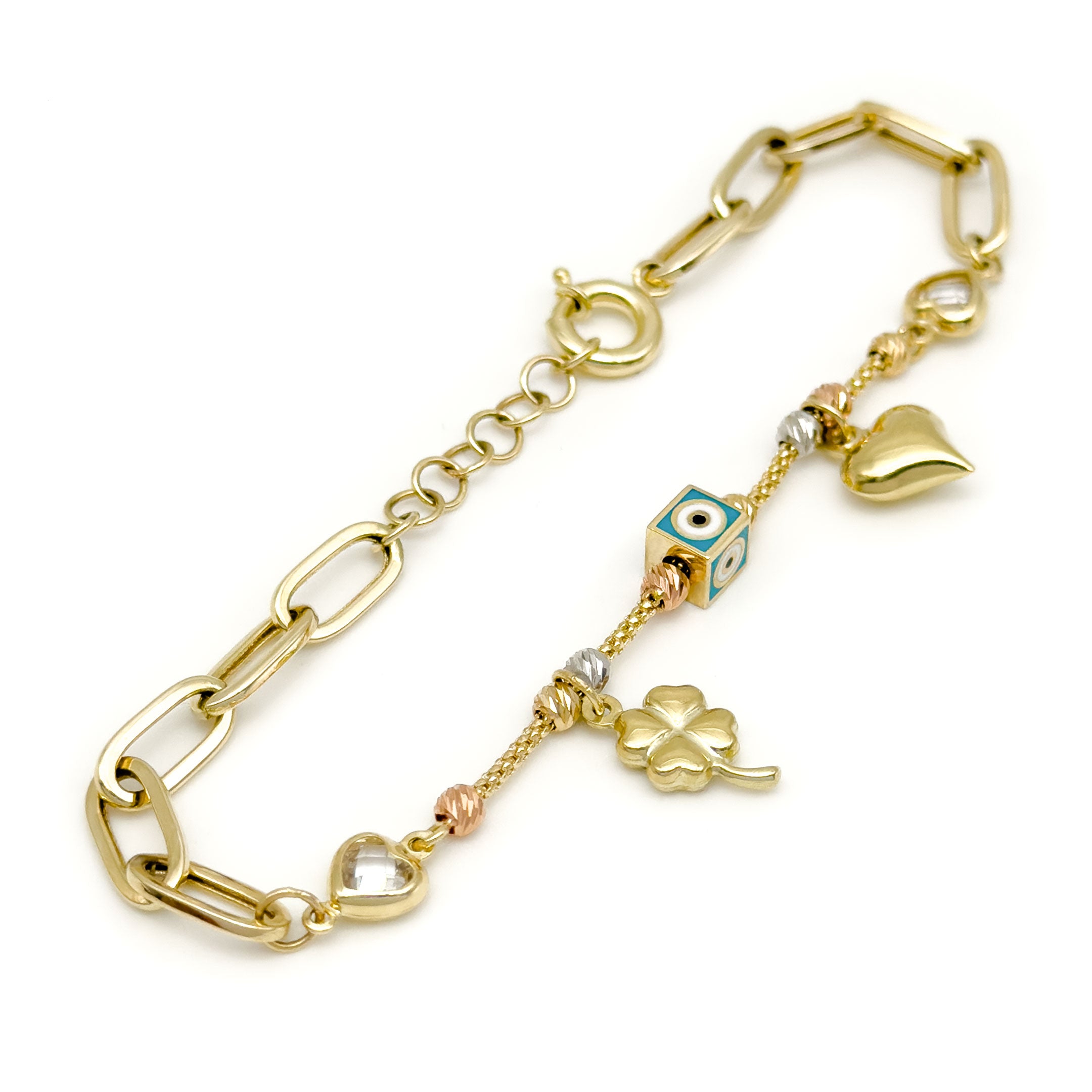 A gold cable chain bracelet with a clasp, featuring heart-shaped bezel-set clear stones, a central evil eye square charm, a dangling gold four-leaf clover charm, and a dangling gold heart charm, all displayed on a clean white background. close