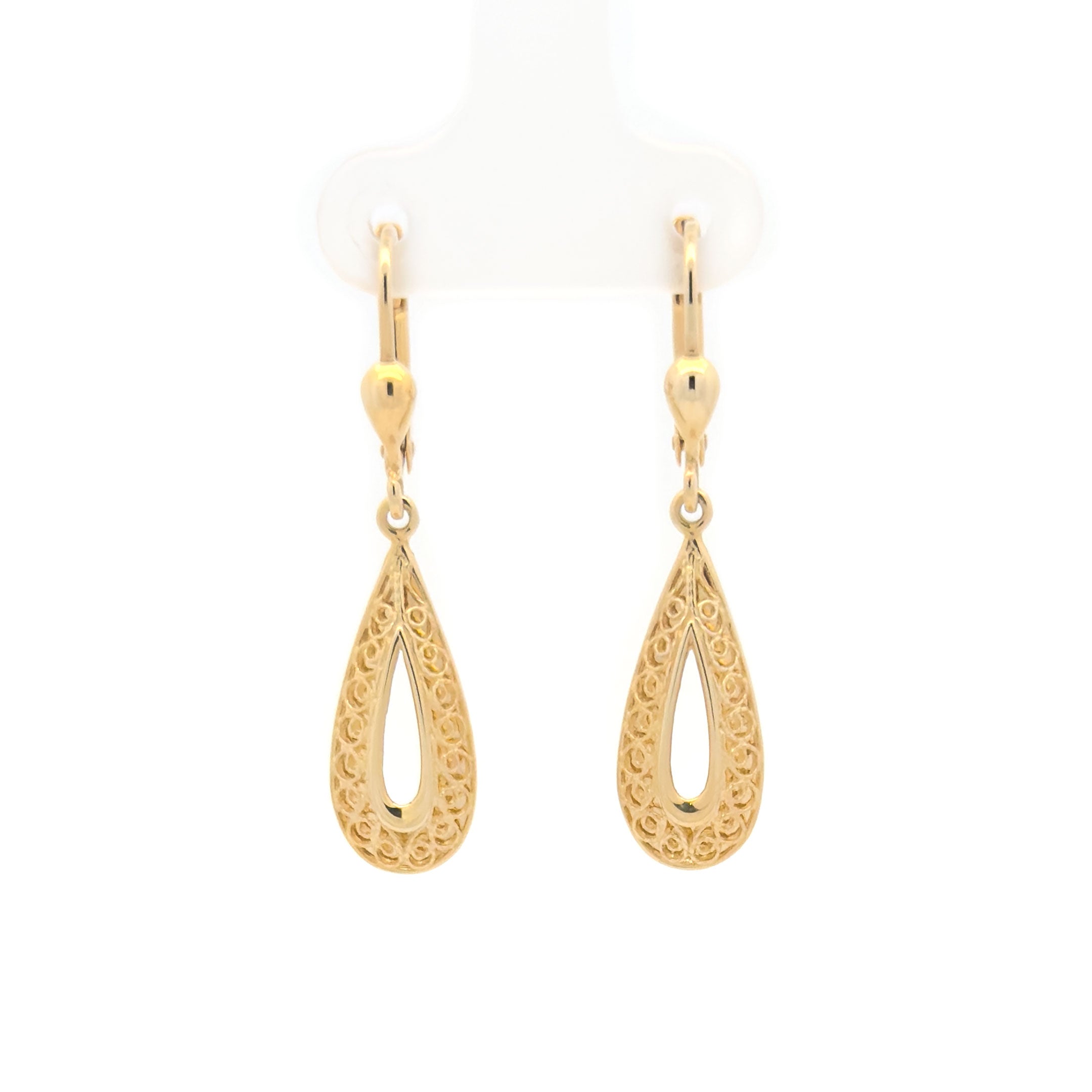 Gold teardrop hanging earrings on a white background