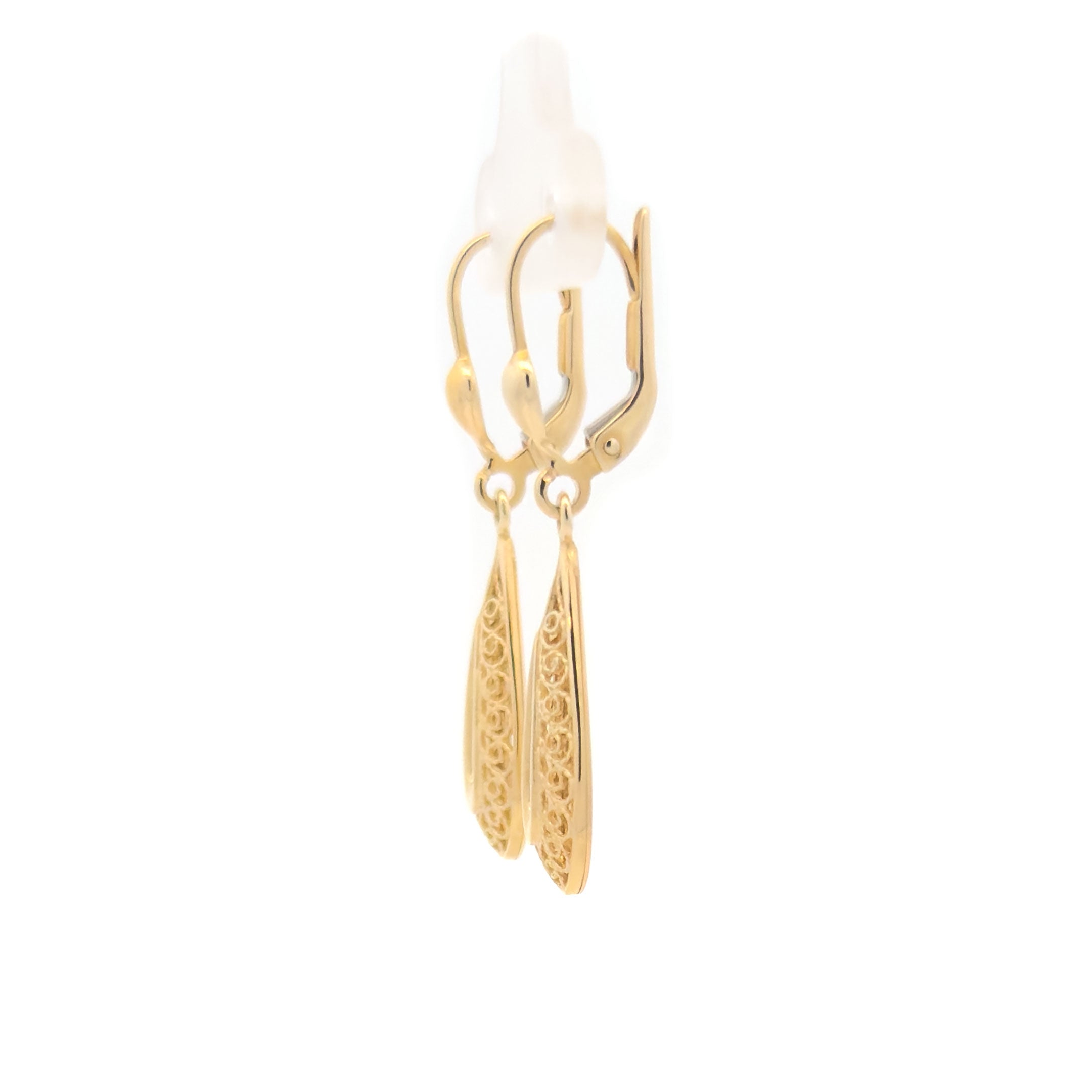 Gold teardrop hanging earrings on a white background side