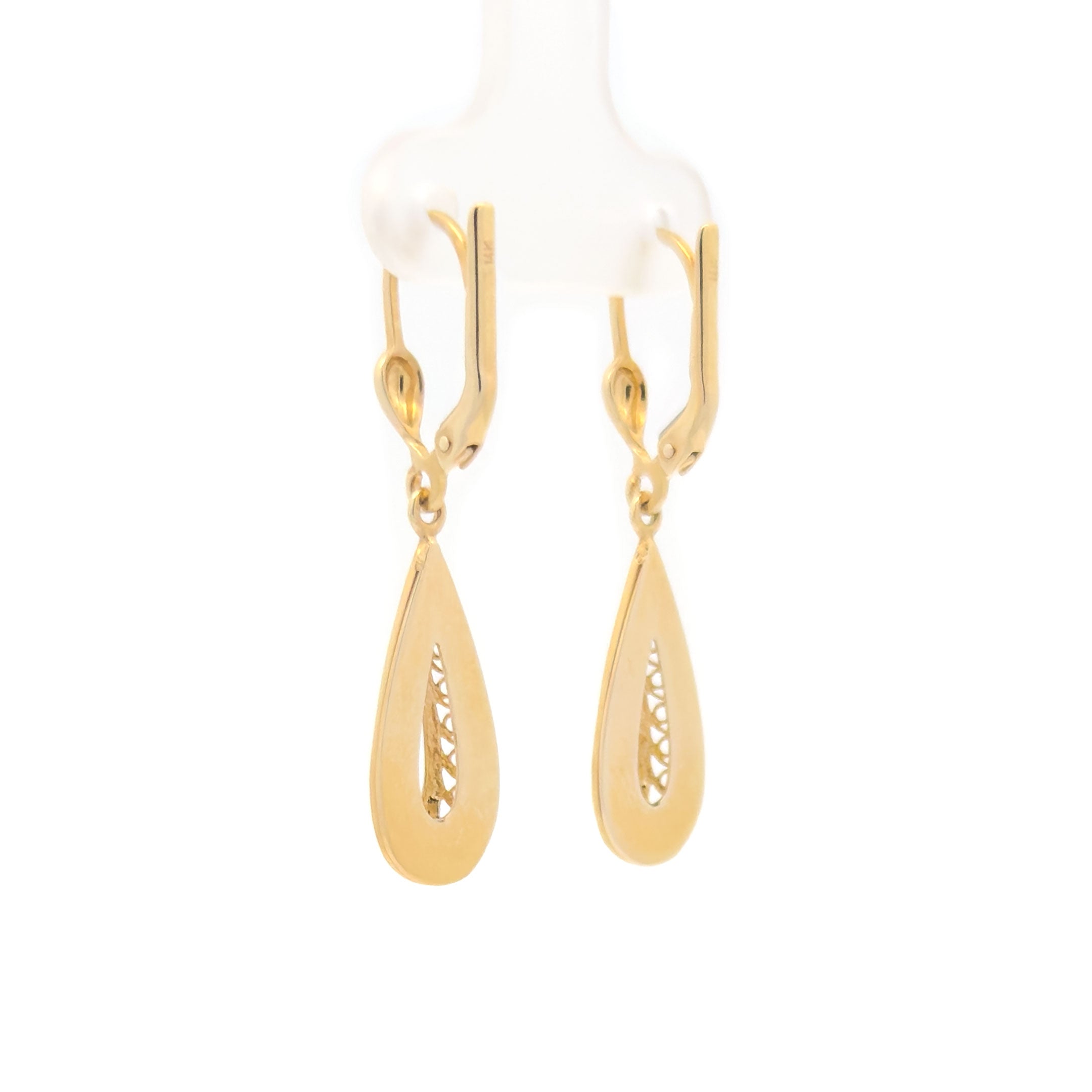 Gold teardrop hanging earrings on a white background back