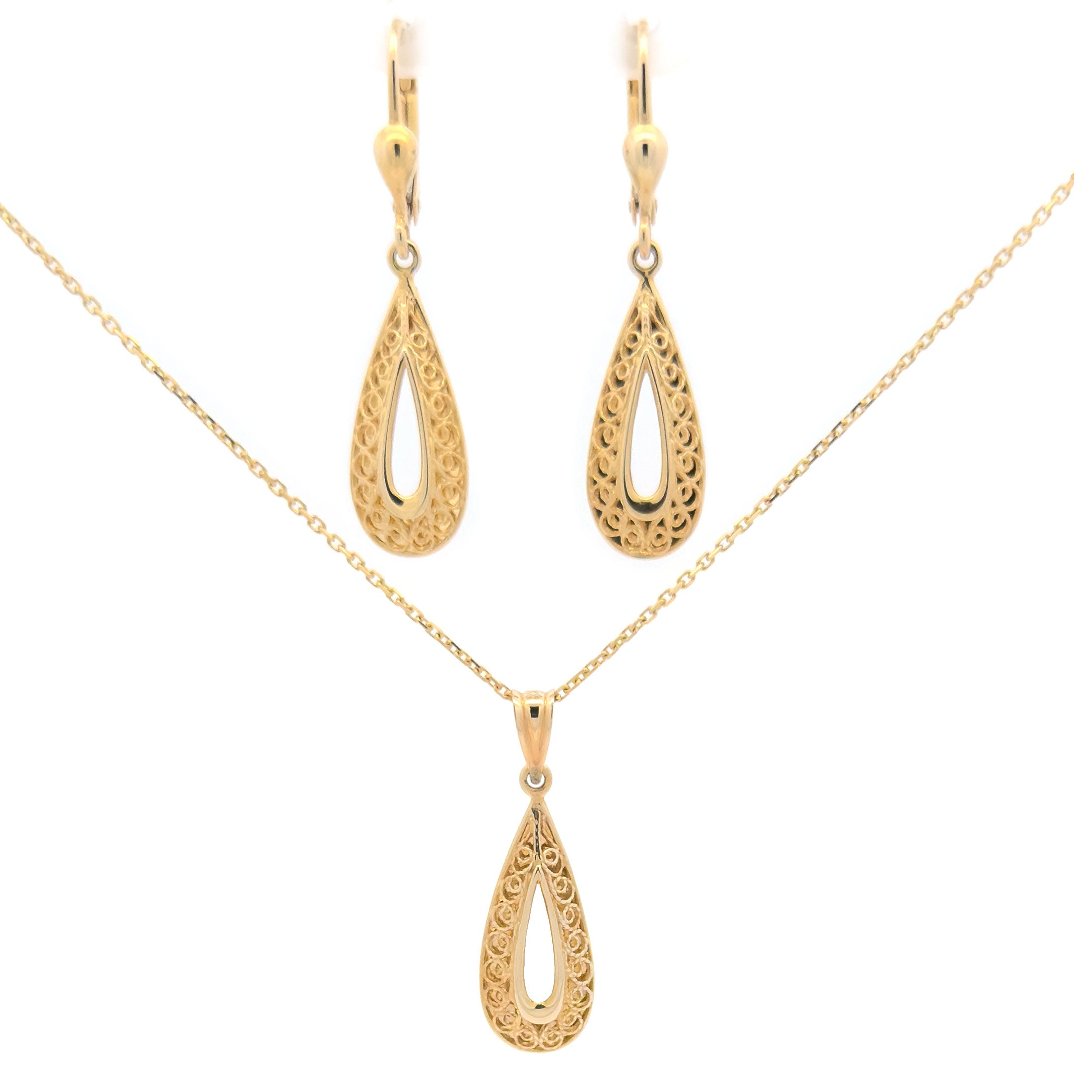 Gold teardrop necklace and earrings set on a white background