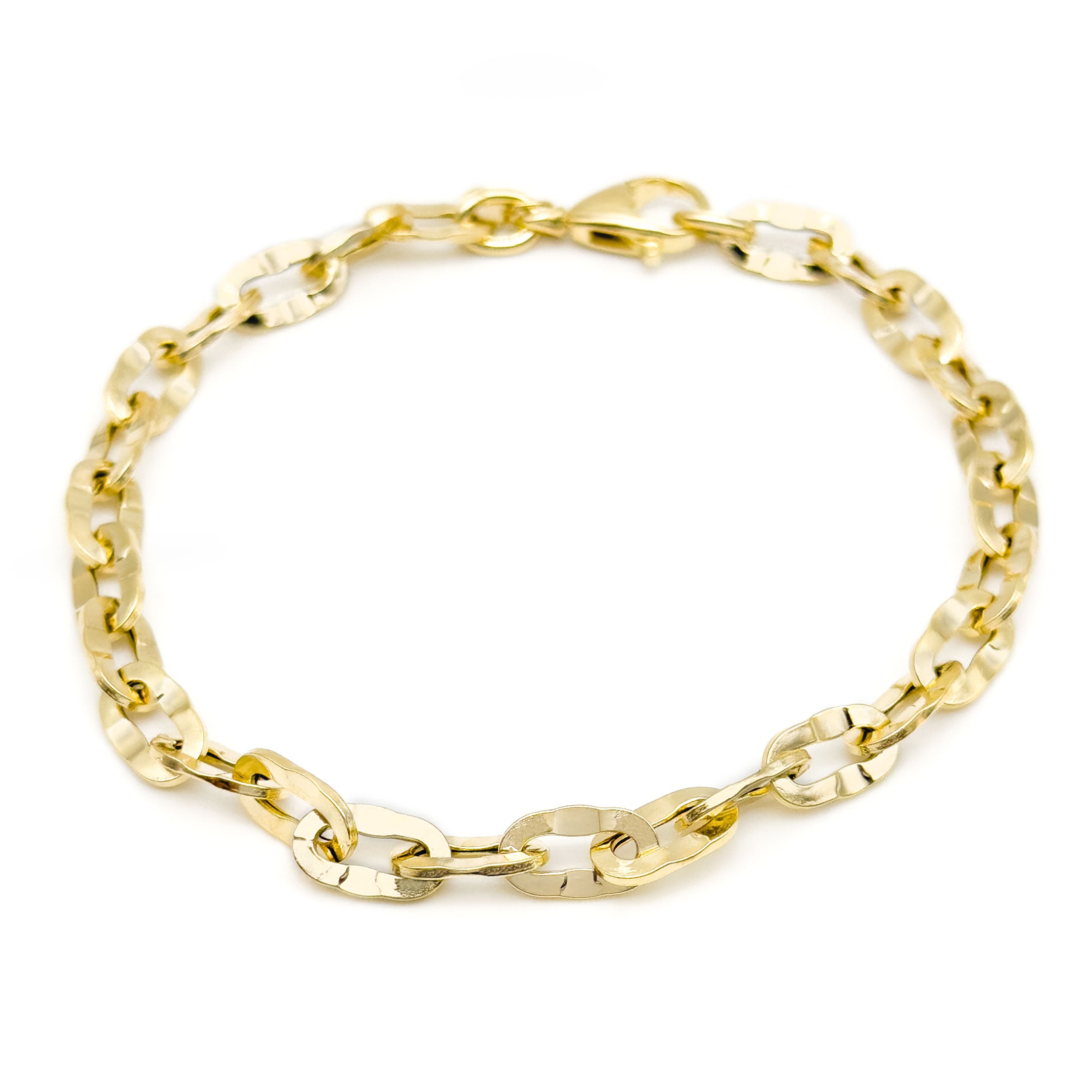 10k yellow gold cable link bracelet with hammered finish on a white background