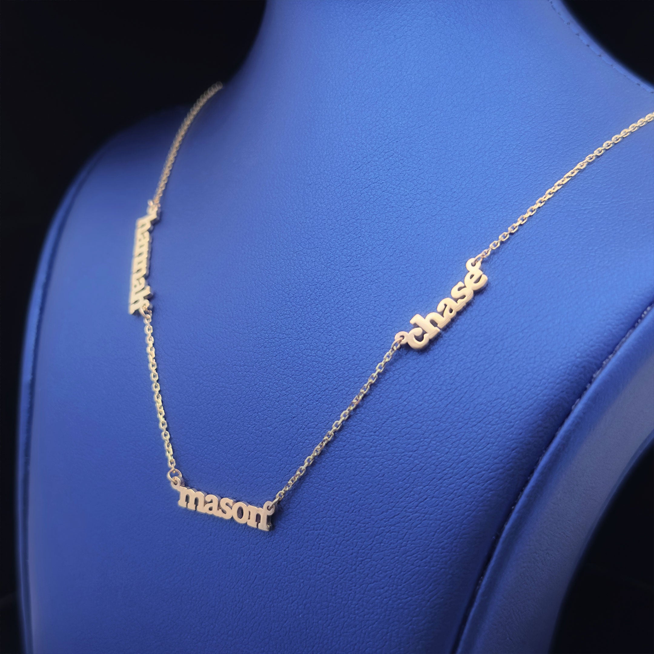 Gold necklace with hannah, mason, chase on blue neck display