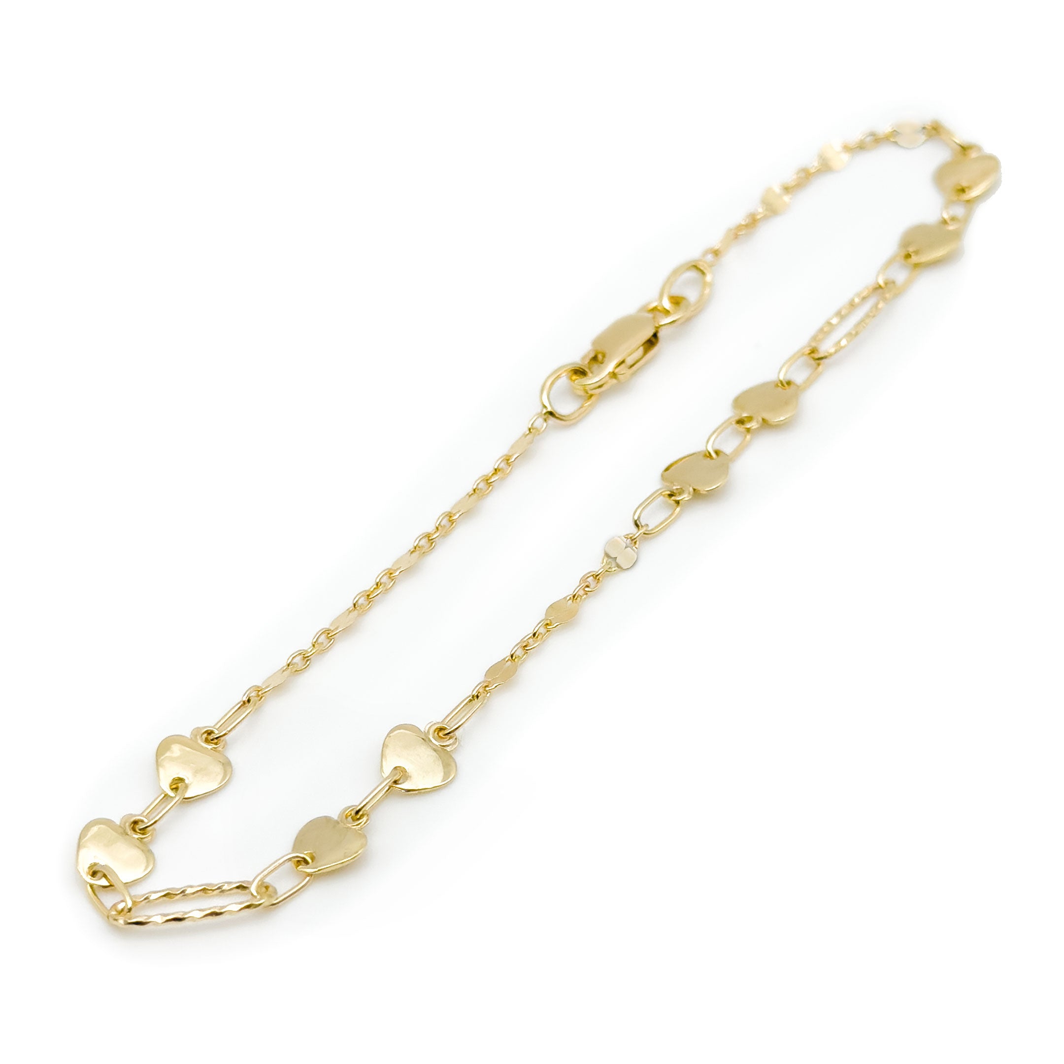 A delicate yellow gold bracelet featuring multiple small, polished heart-shaped links, displayed on a clean white background. close