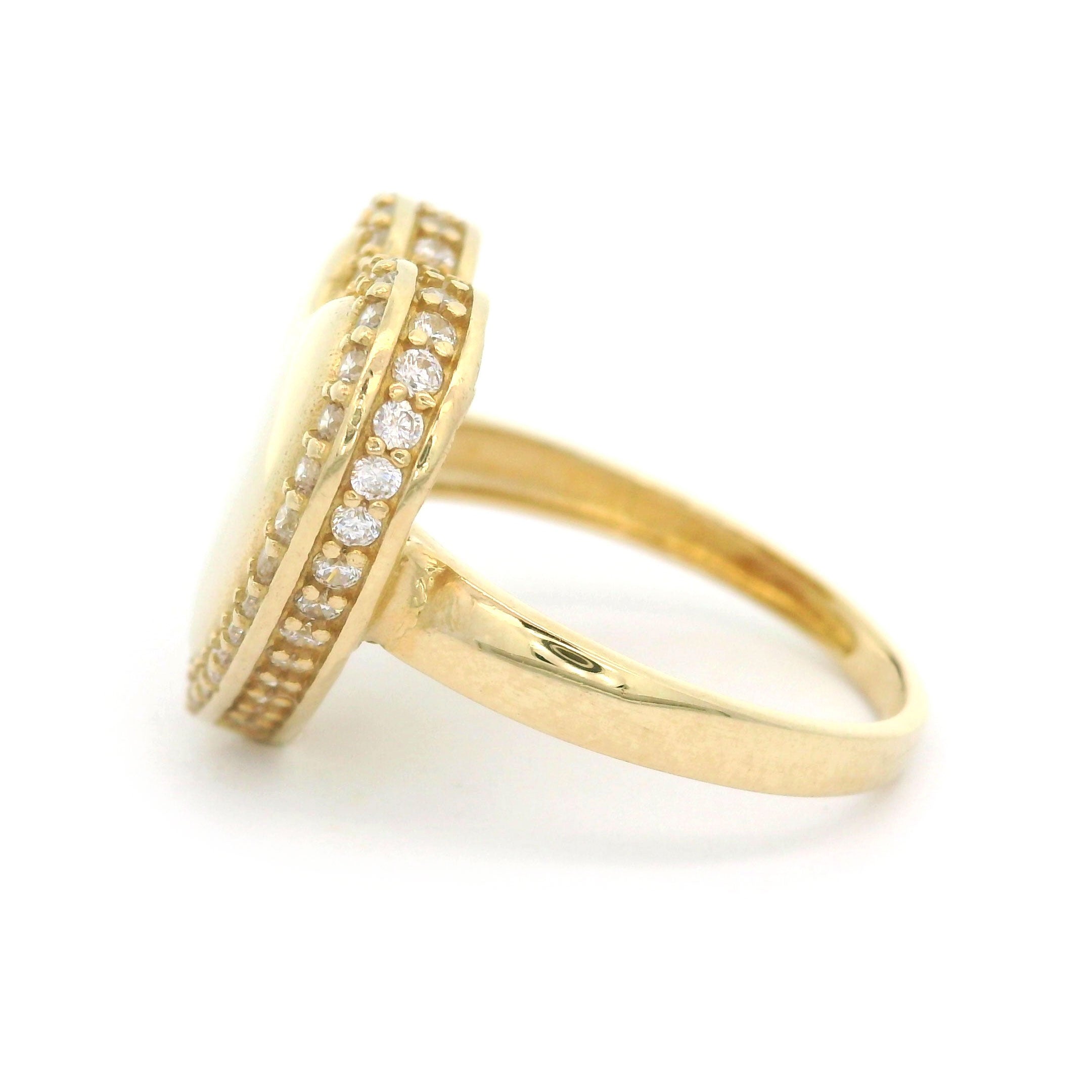 10k yellow gold heart ring with stones around border on white background side view
