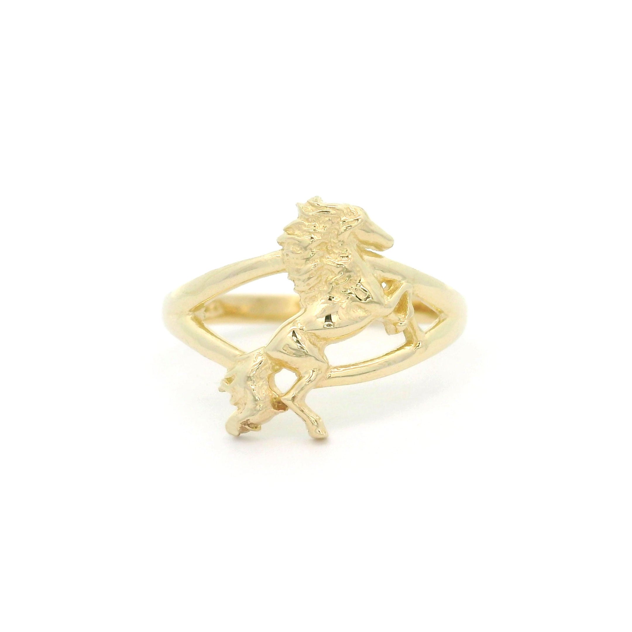 10k yellow gold ring with a horse in rearing pose on a white background