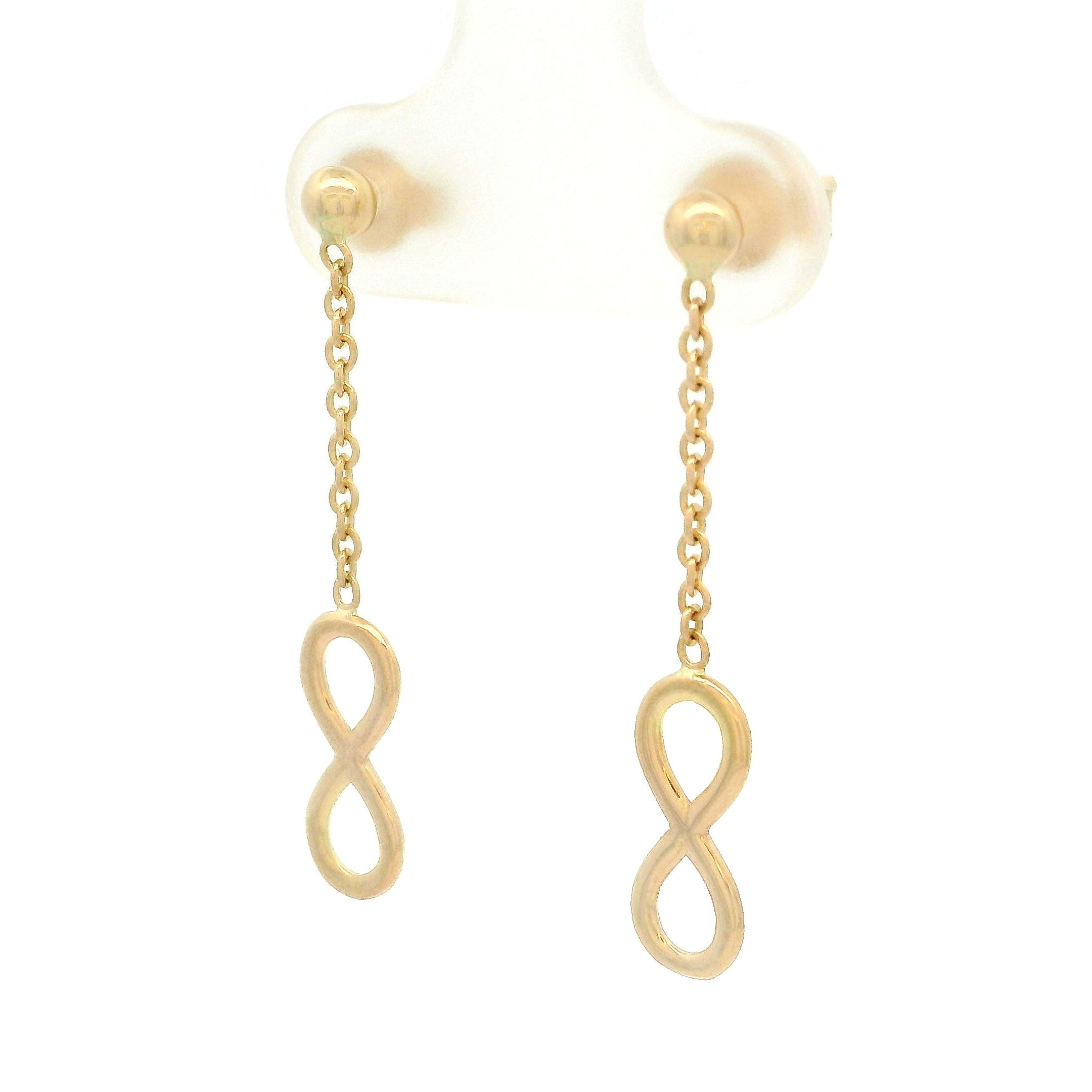 14k yellow gold hanging infinity earrings on white background
