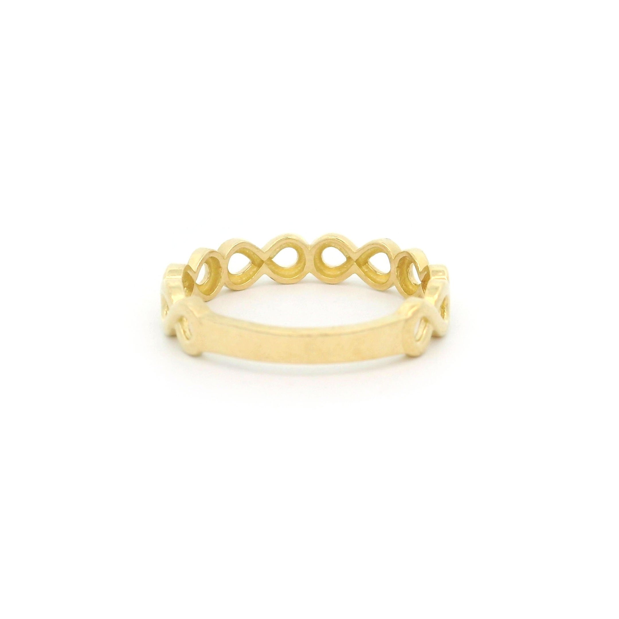 10k yellow gold ring with a infinity design on a white background back view