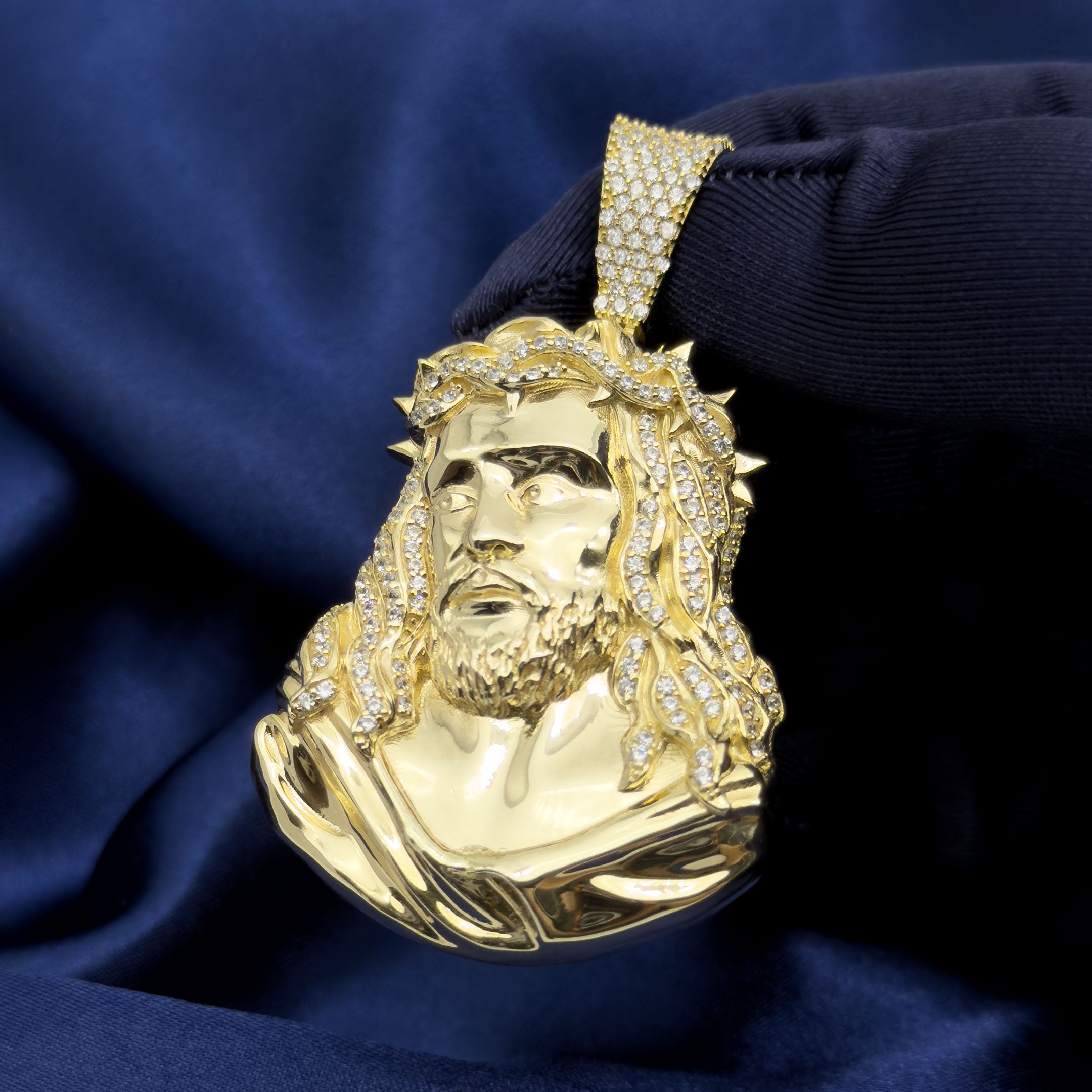 10k Yellow Gold Jesus Head Pendant with Thorns on blue background