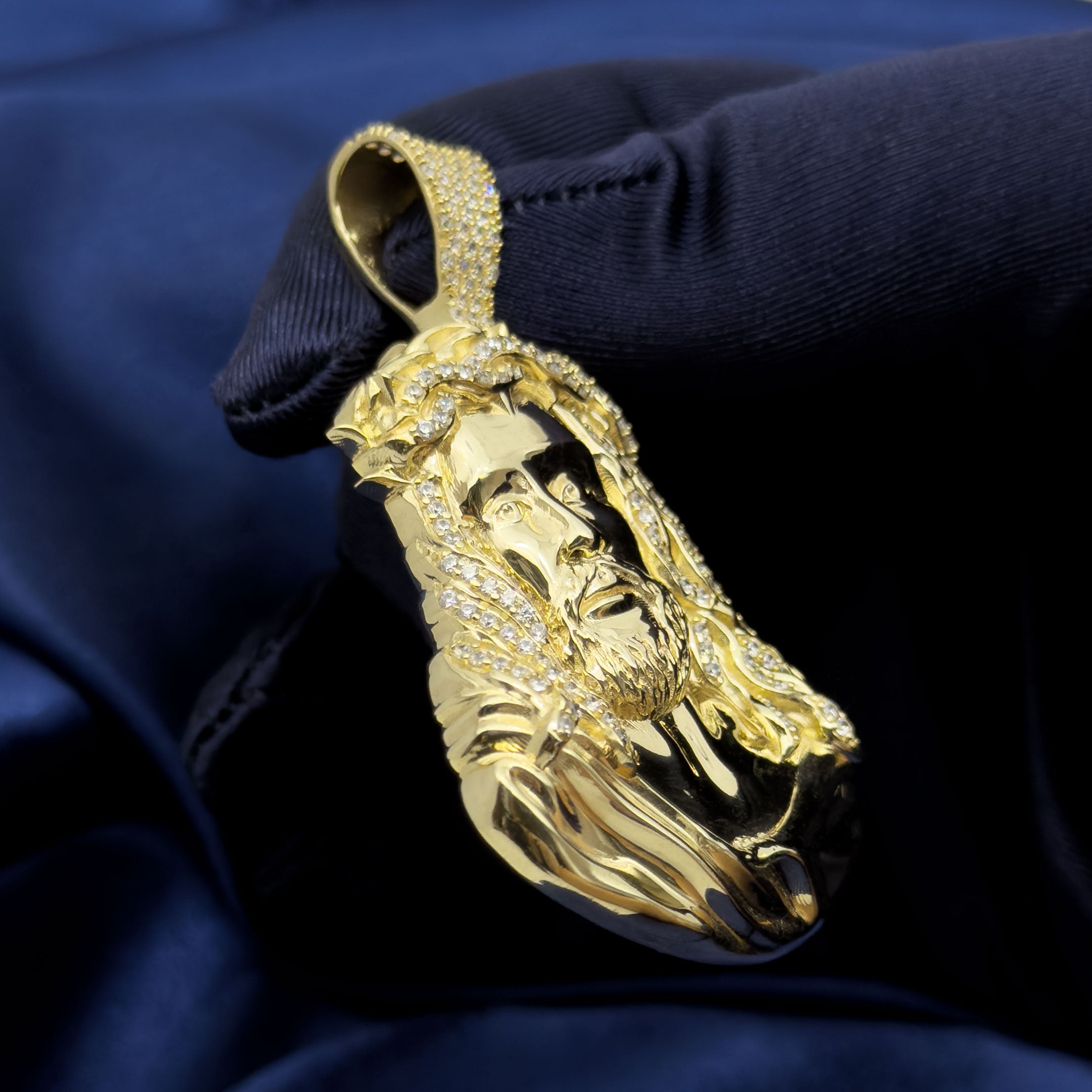 10k Yellow Gold Jesus Head Pendant with Thorns on blue background left side