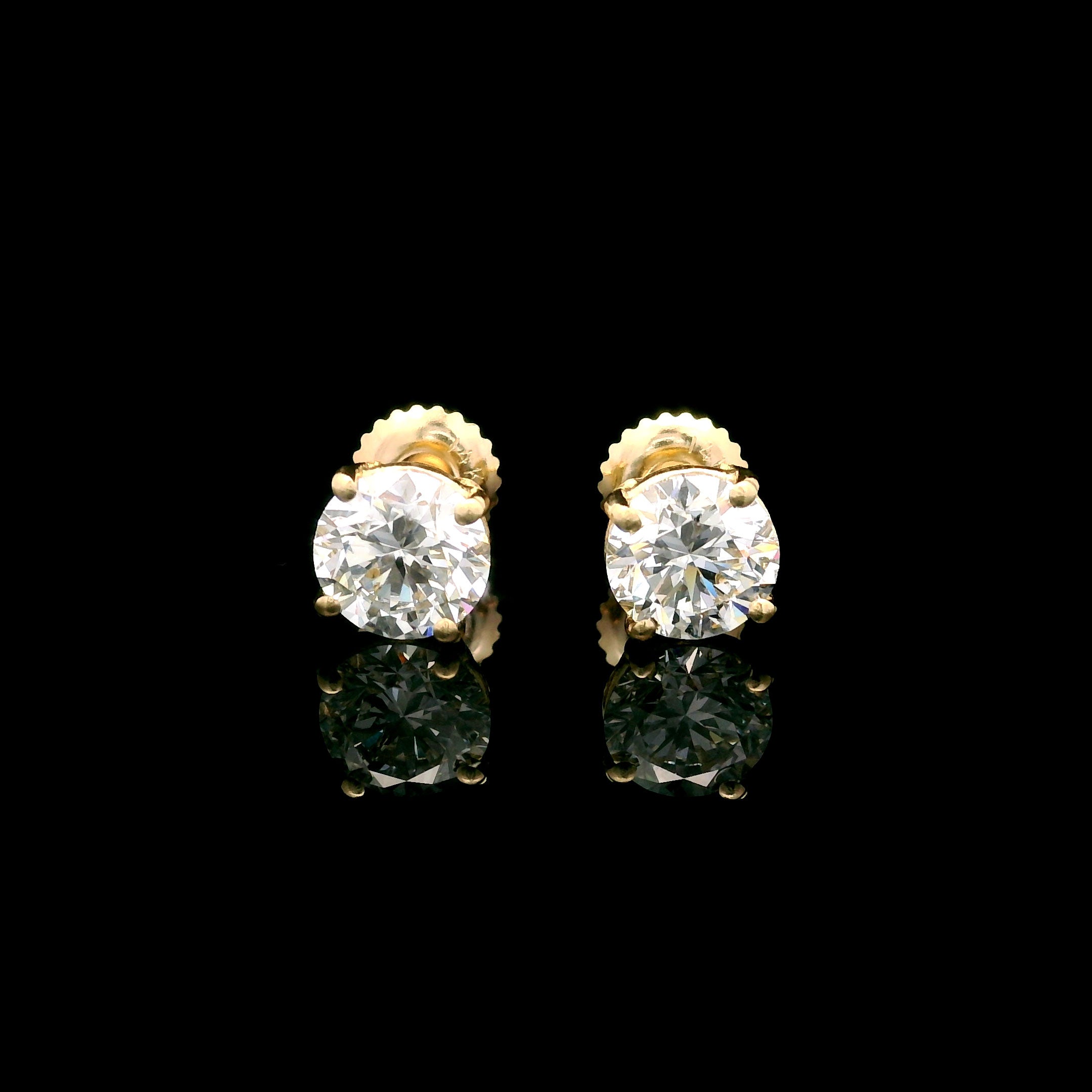 14k Gold 2 CTW Lab-Diamond Four-Prong Solitaire Screw Back Stud Earrings on black background