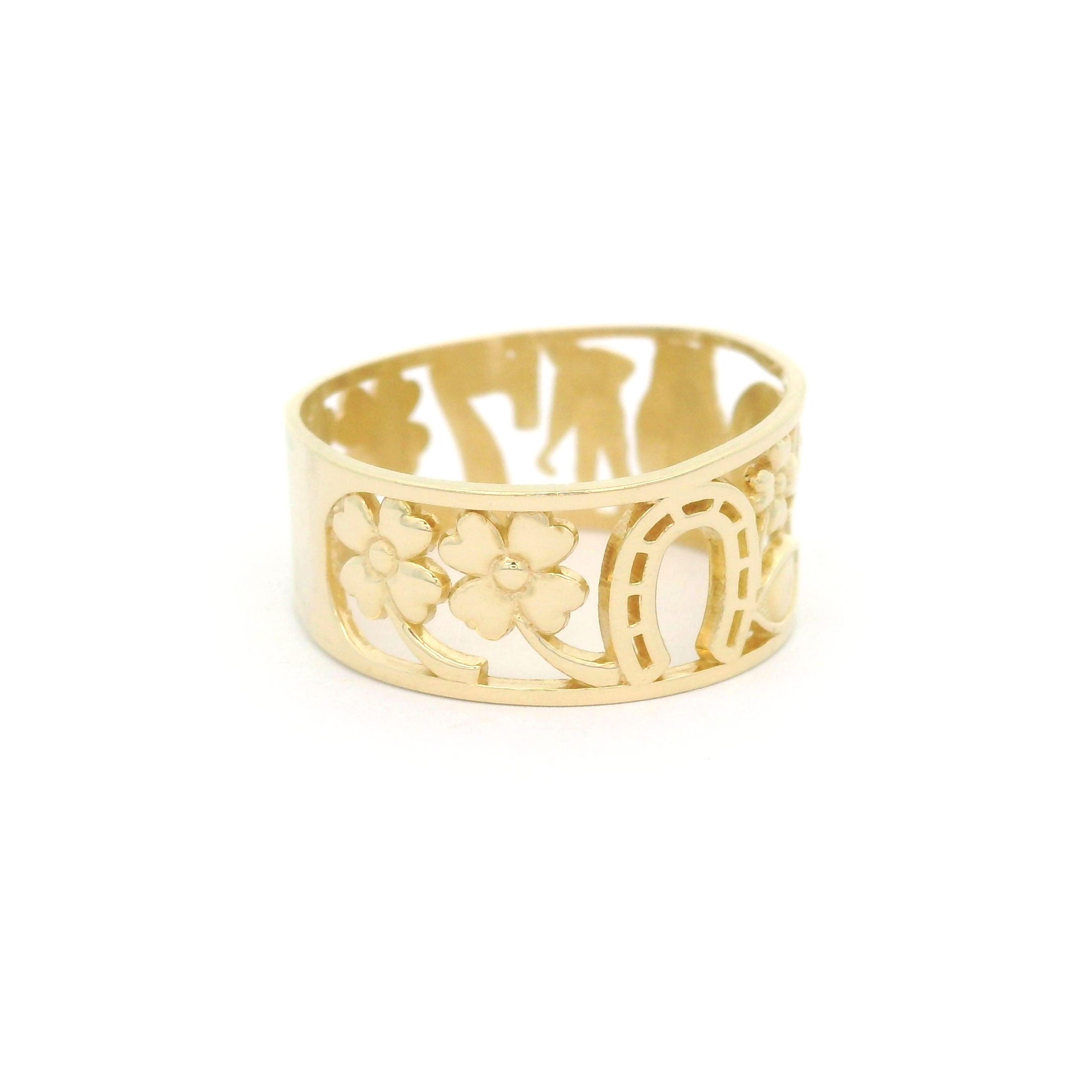 10k yellow gold ring with lucky clover and horseshoe design on a white background