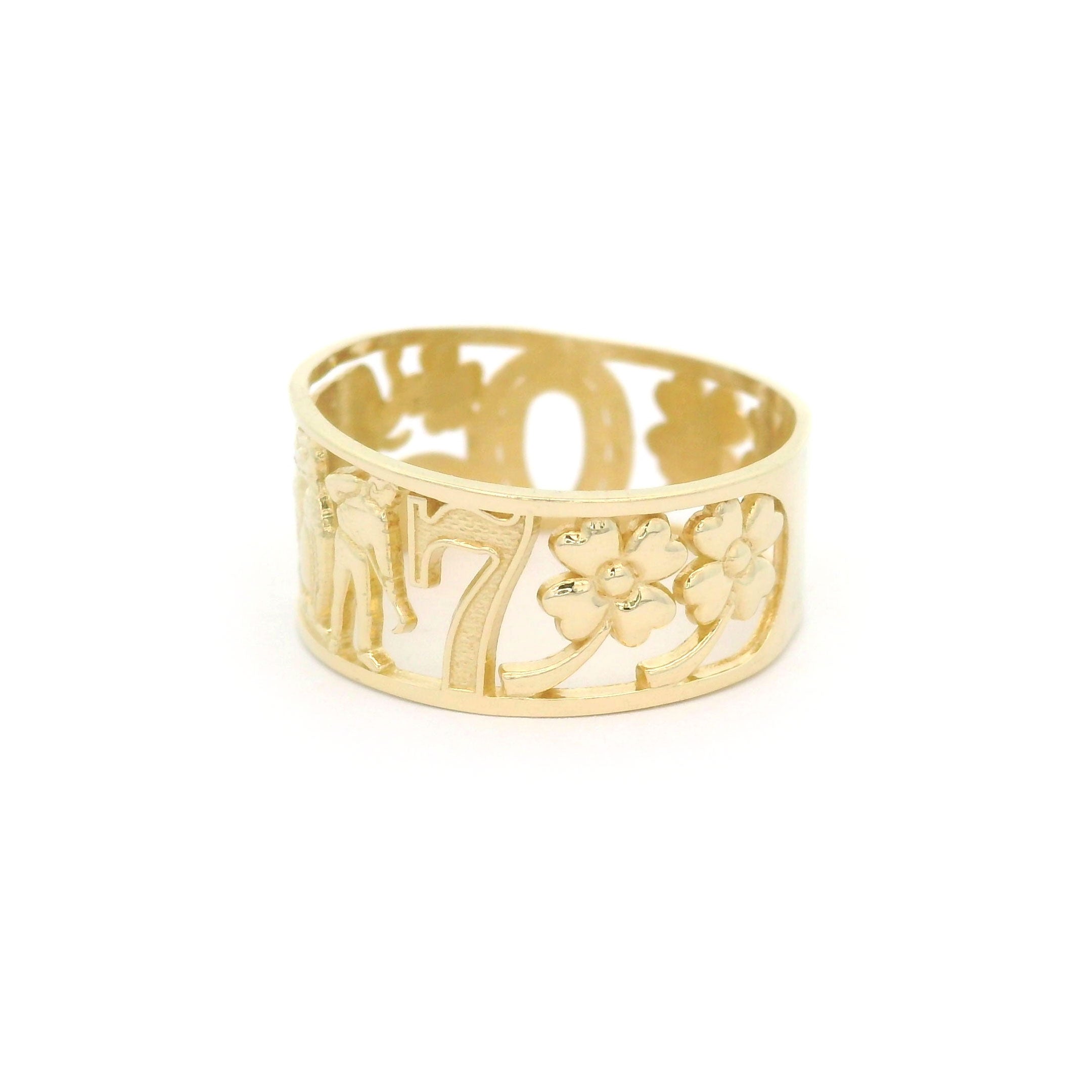 10k yellow gold ring with lucky number 7 and clover design on a white background