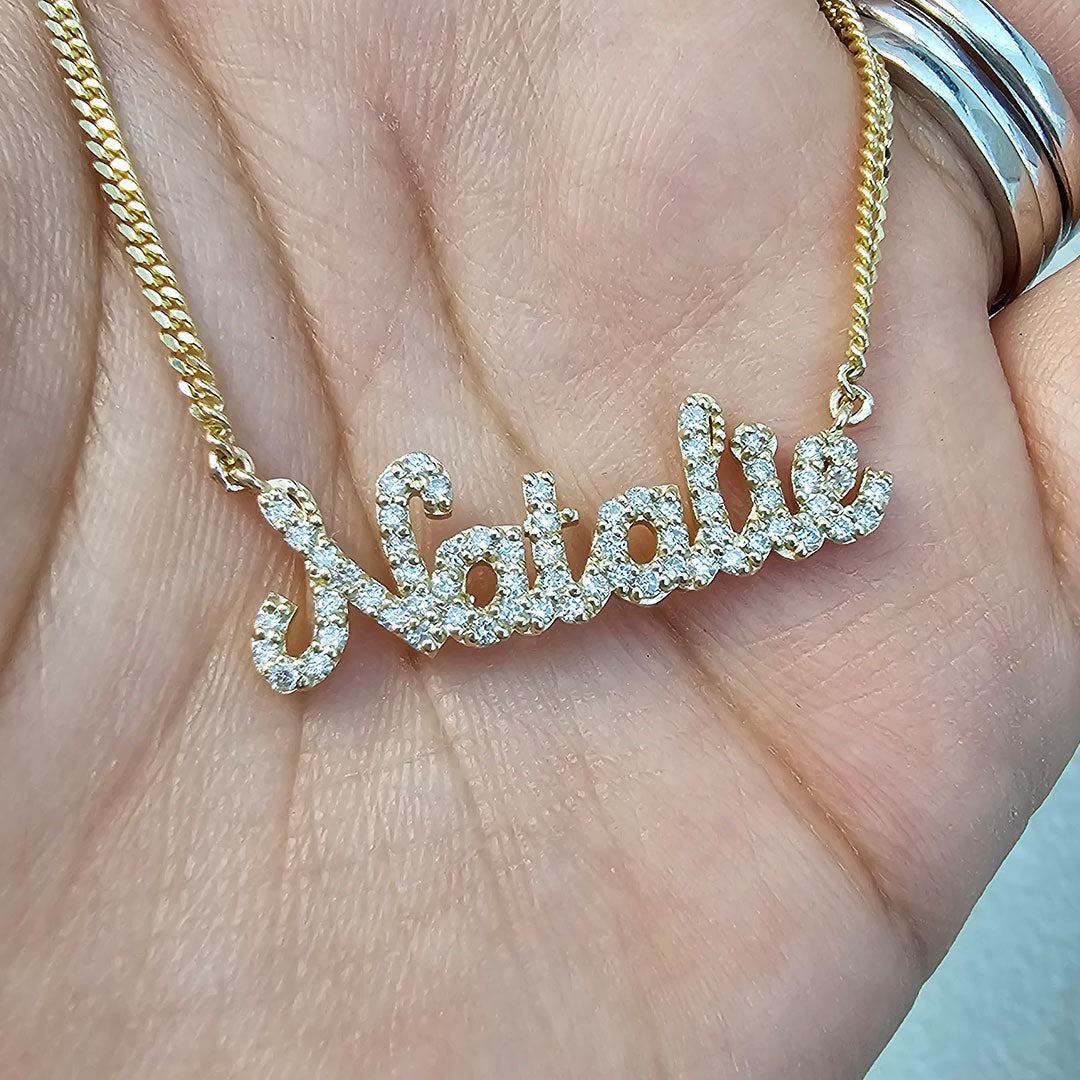 Personalized Natalie Diamond Script Sample Name Necklace in Gold in Hand