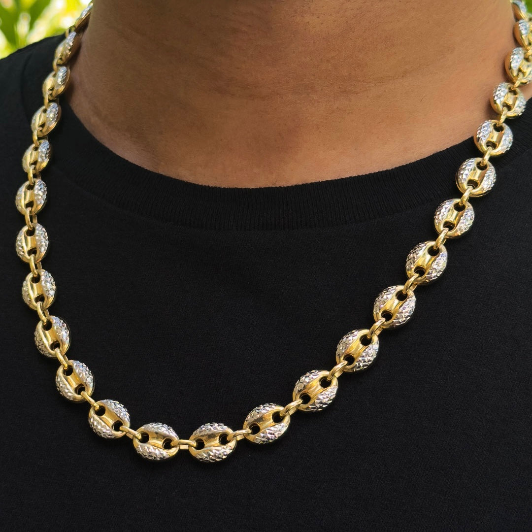 11mm 10k Two-tone Gold Mariner Puff Chain with Diamond Cuts on a person