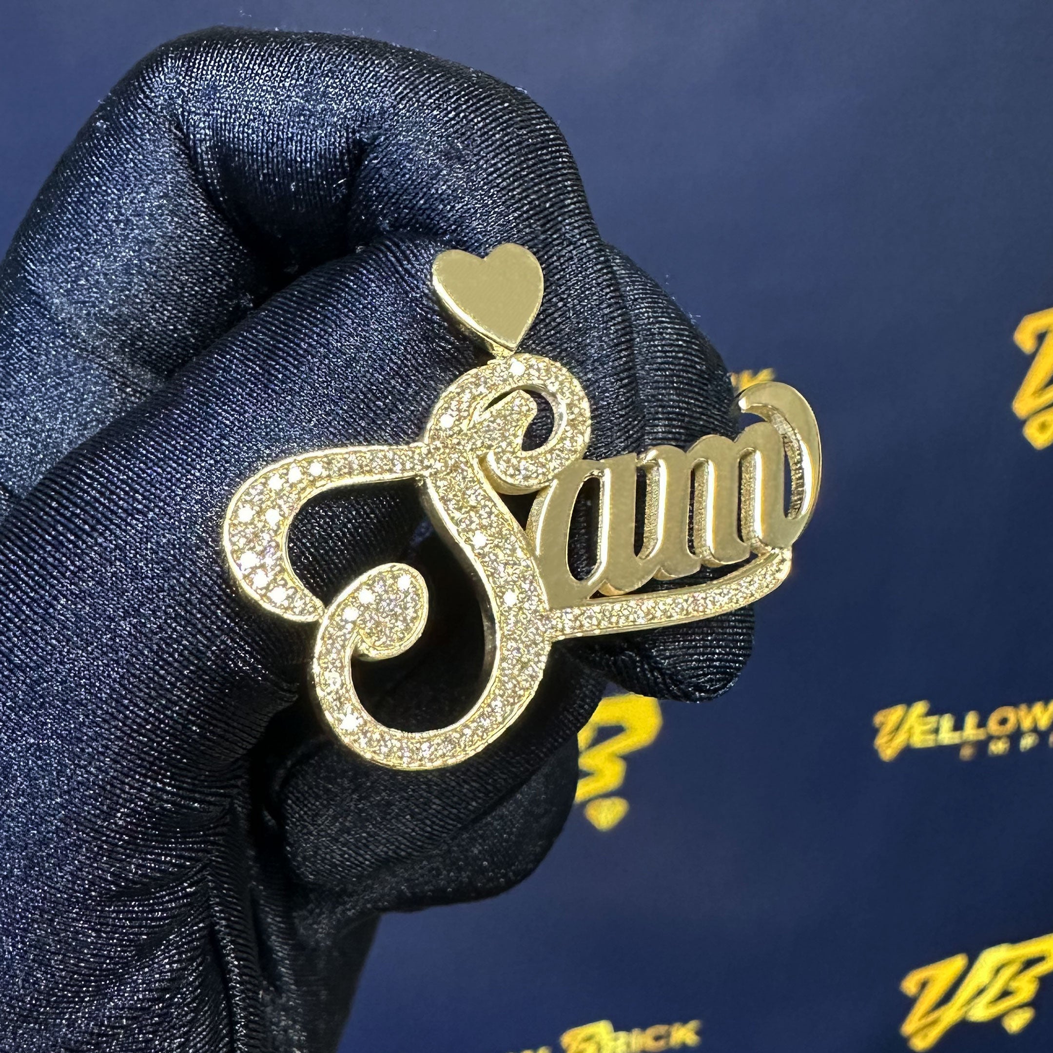 Custom Sam name with Diamond Capitol Letter and Underline in a Hand with Blue Glove with a YB Background