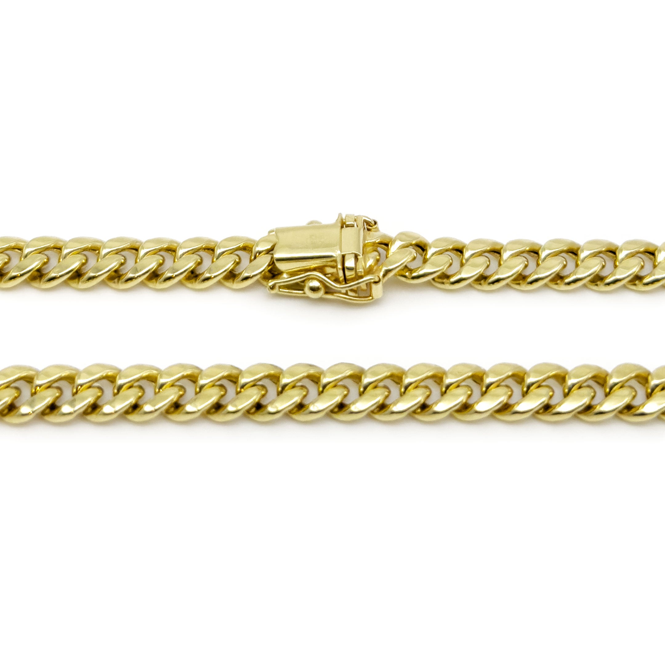 10k Yellow Gold Semi-Hollow Cuban Chain 5.75mm on a white background close up back of box lock