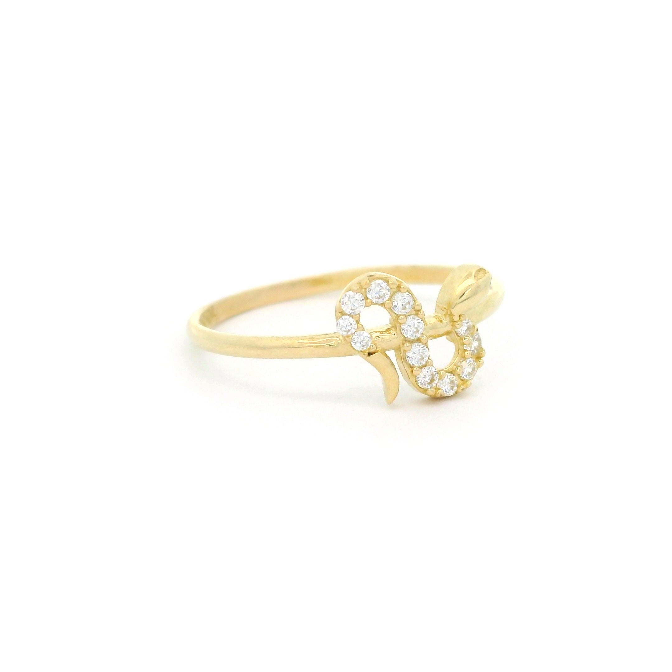 10k yellow gold ring with snake design and cz stones on a white background left side