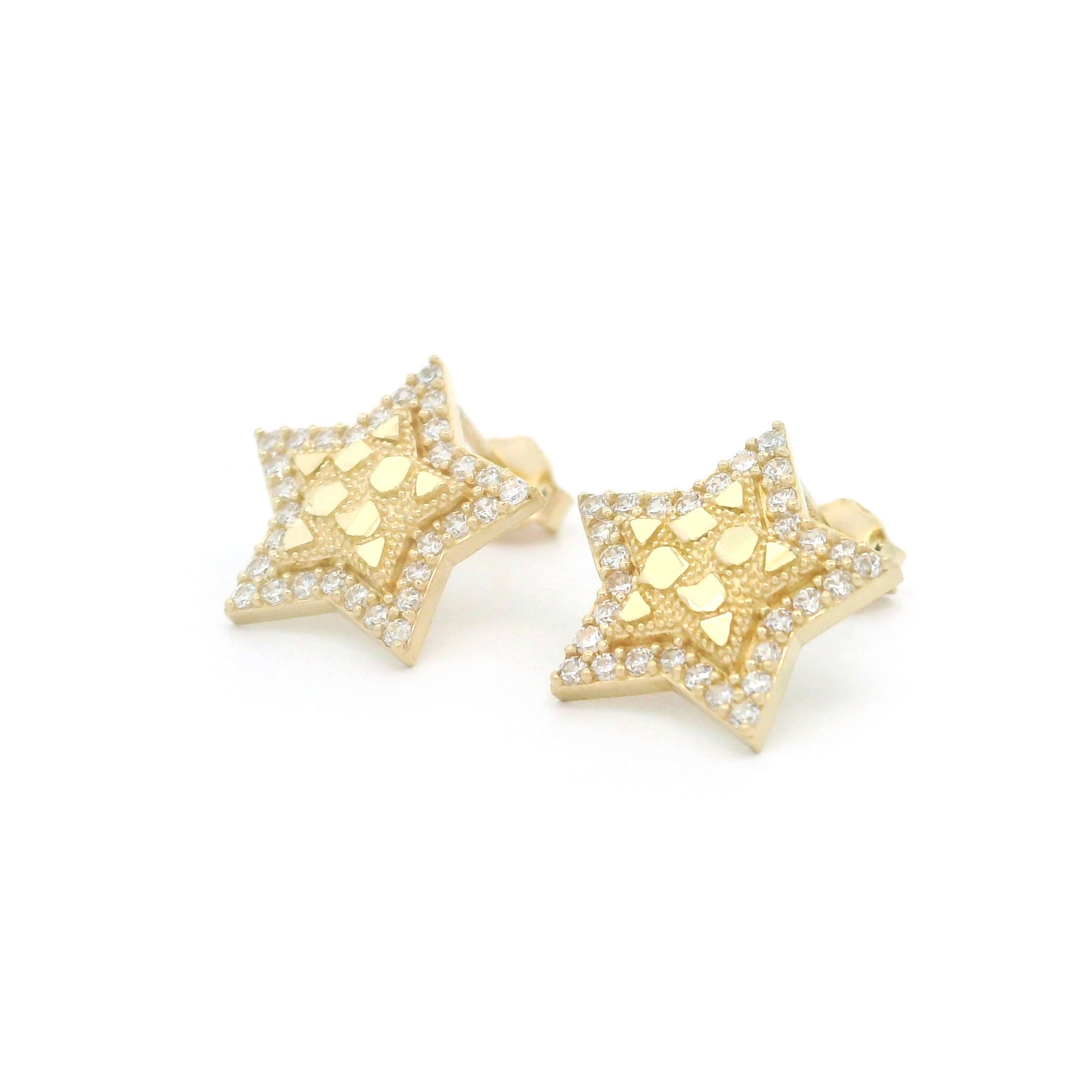 10k gold old star shaped earrings with cz stone border on a white background side view