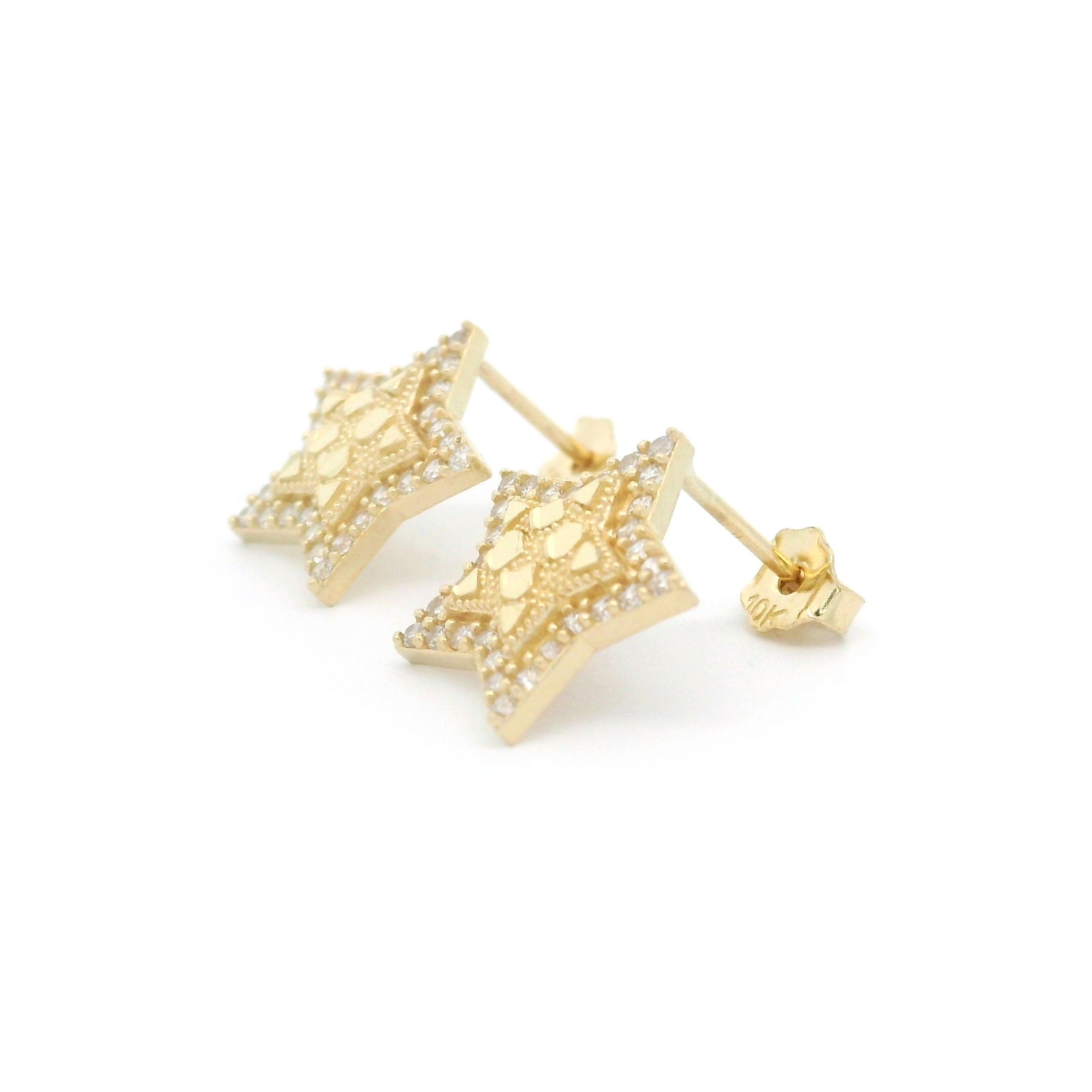 10k gold old star shaped earrings with cz stone border on a white background side view