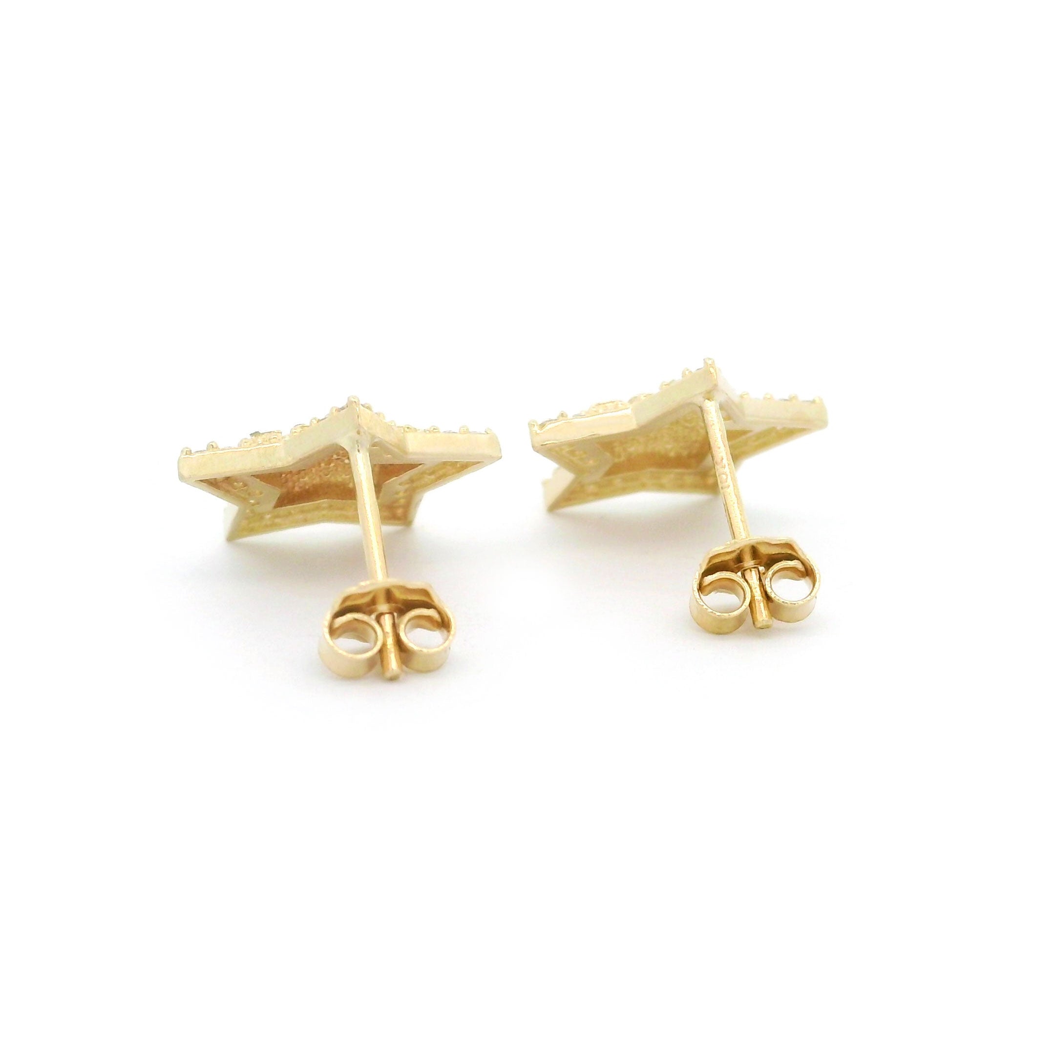 10k gold old star shaped earrings with cz stone border on a white background back view