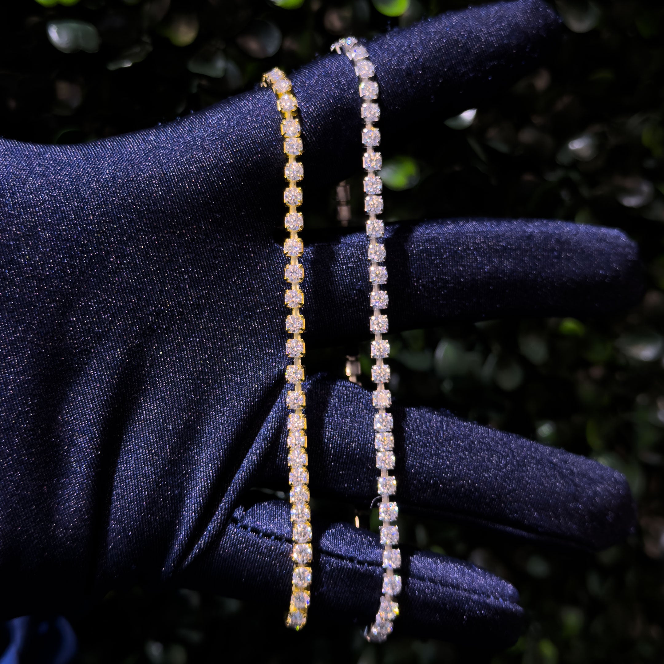 925 Sterling Silver Stretch Moissanite Tennis Bracelet - both stretched with a hand with blue glove