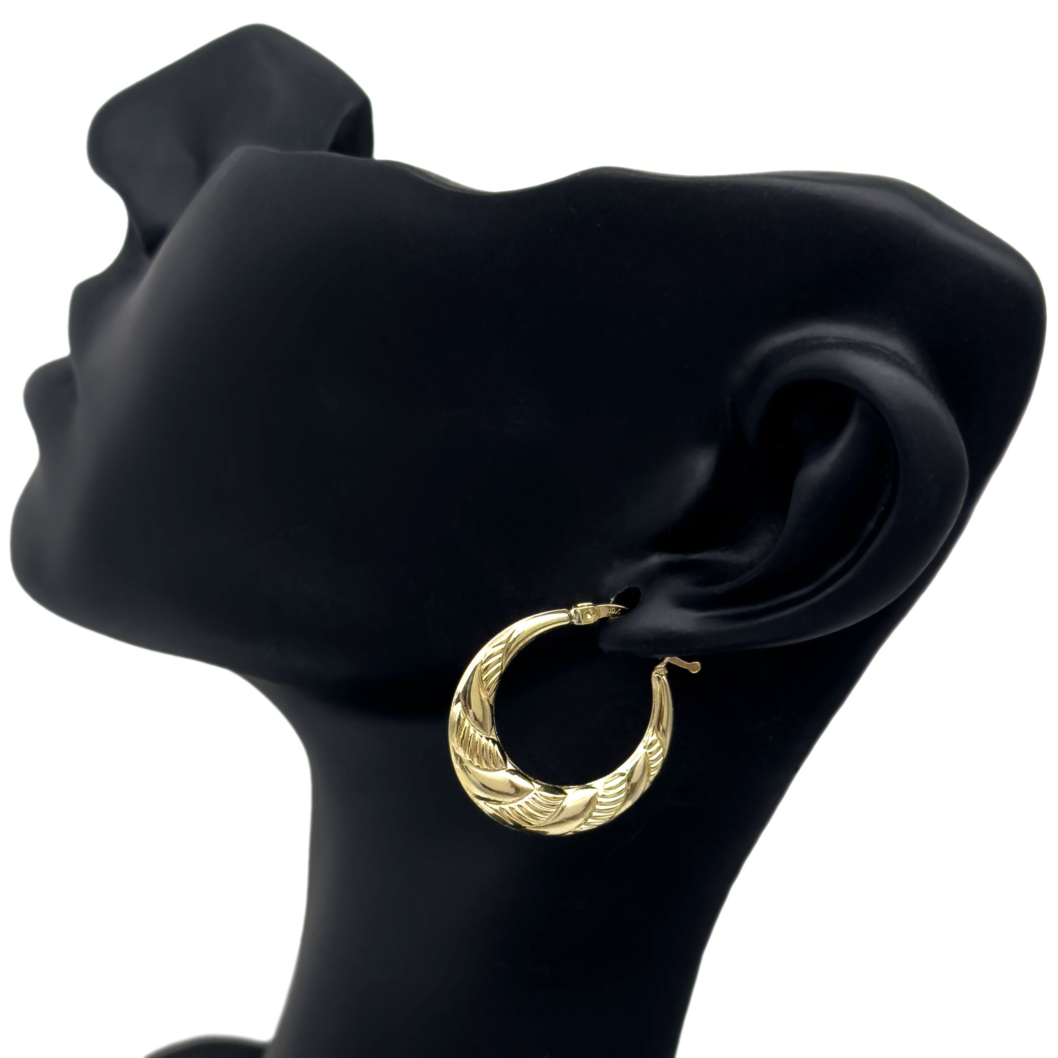 10k gold hoop earrings with swirl design on mannequin display side view